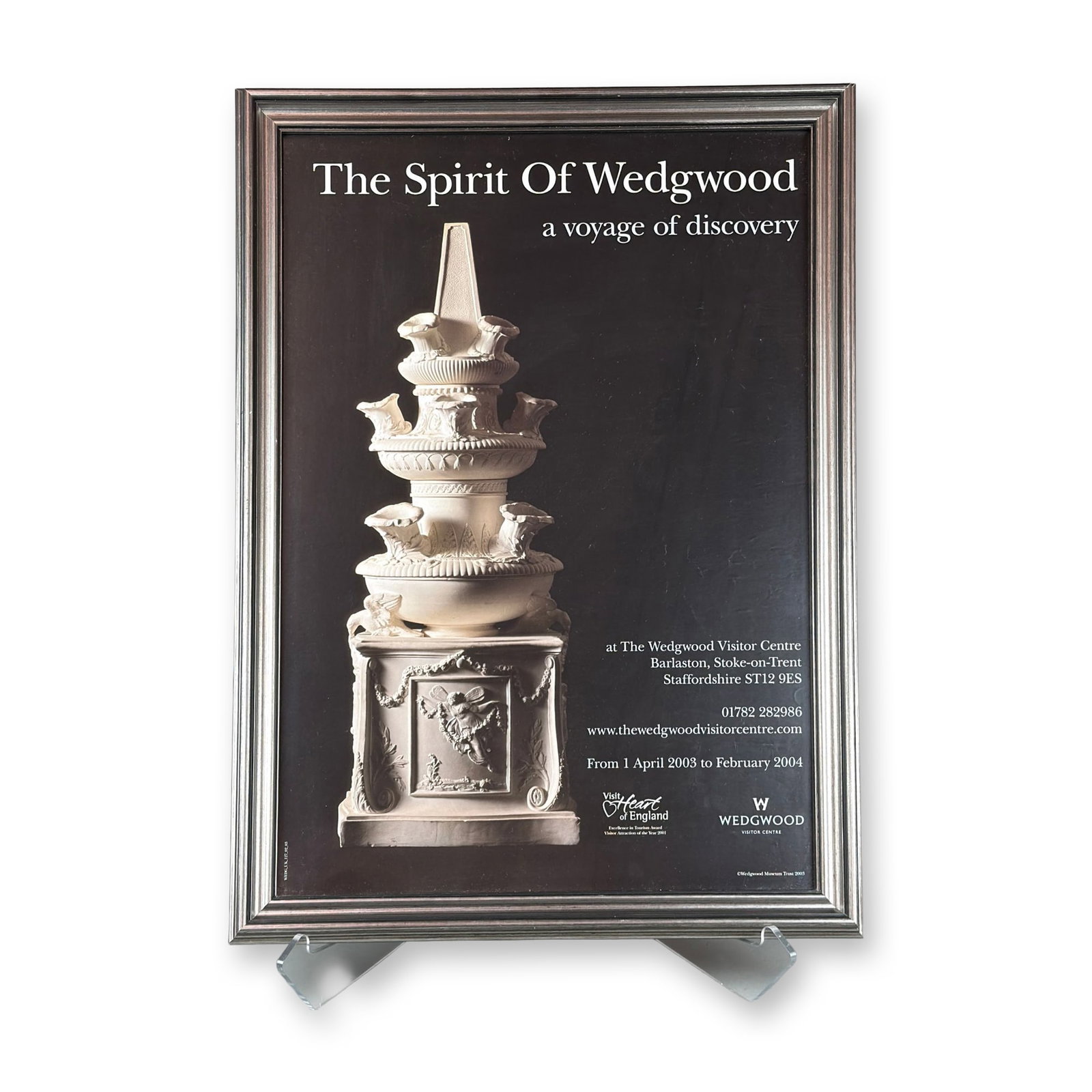 Framed Exhibition Poster The Spirit of Wedgwood 2003-2004: A framed exhibition poster titled The Spirit of Wedgwood: a voyage of discovery, promoting an exhibition held at The Wedgwood Visitor Center in Barlaston, Stoke-on-Trent. The exhibition ran from April