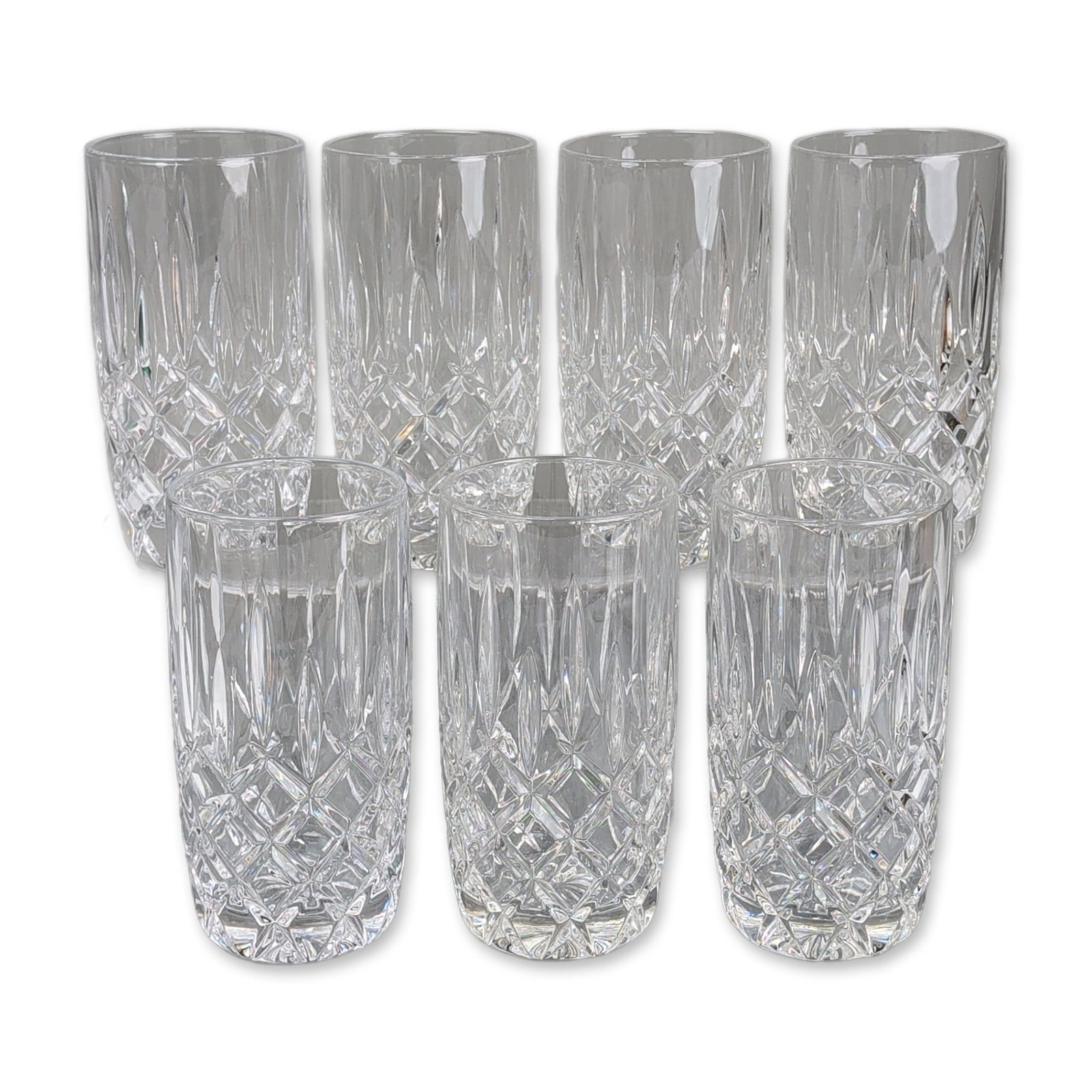7pc Cut Crystal Highball Glasses: Lead crystal highball tumblers featuring hand-cut wedge miters on the upper body and diamond cross-hatching below. Each piece is finished with a sixteen-point starburst cut on the base. Dimensions: