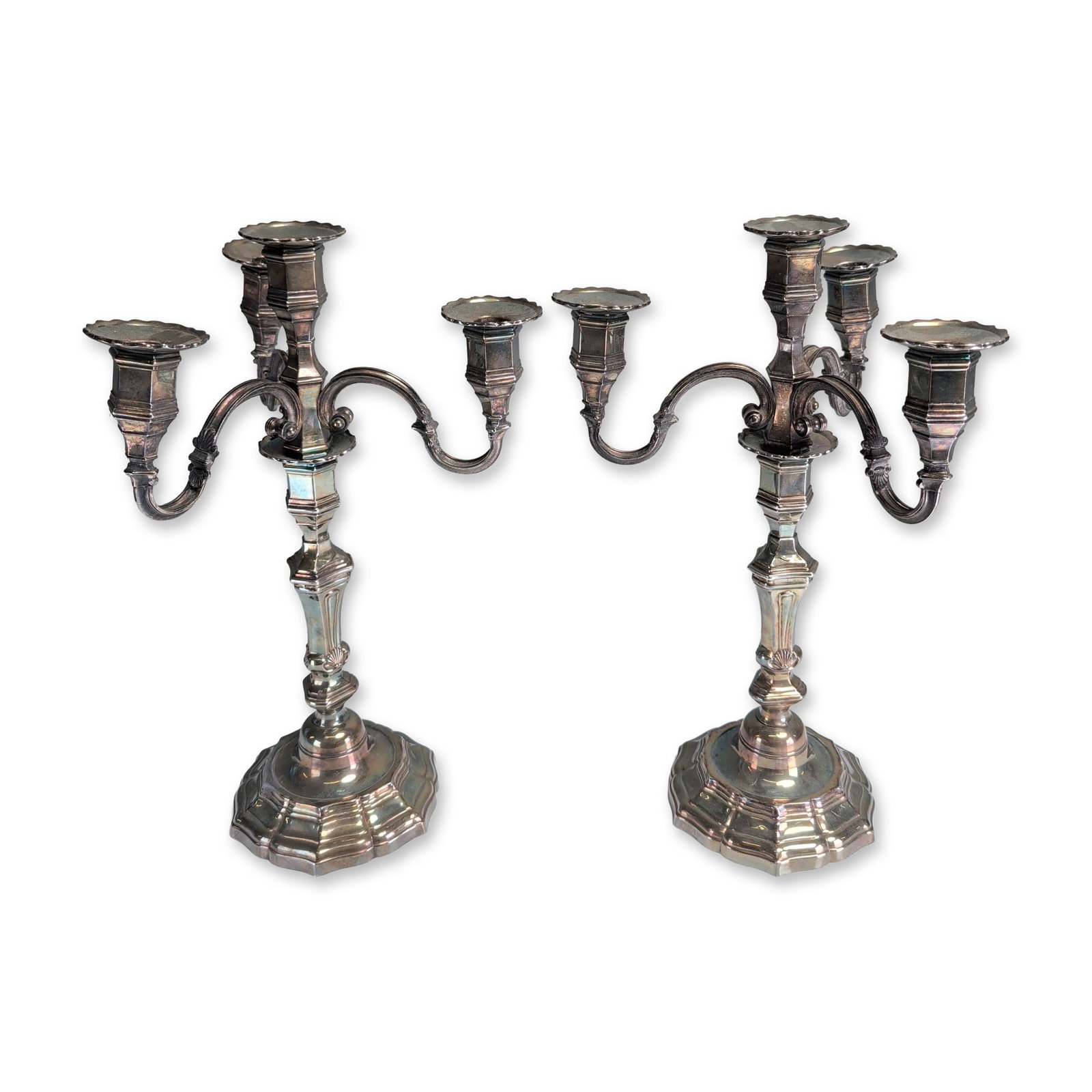 2pc Rococo Style Silver-Toned Five-Light Candelabra: A pair of silver-toned five-light candelabra in the Rococo revival style. Each piece features four scrolling arms surrounding a central light, supported by knopped baluster stems with shell and