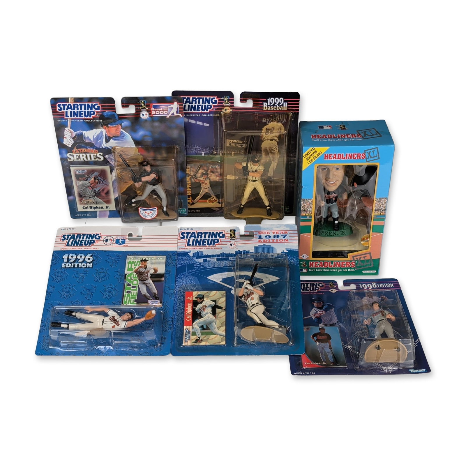 6pc Kenner & Hasbro Cal Ripken Jr. Action Figures and Corinthian Bobblehead: A collection of factory-sealed sports collectibles featuring Baltimore Orioles player Cal Ripken Jr., produced between 1996 and 2000. The group comprises five Starting Lineup action figures by Kenner 