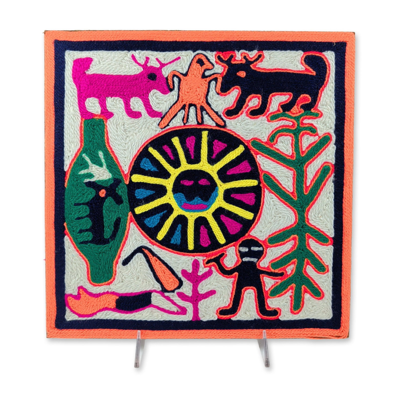 Huichol Mexican Folk Art Sun Deity Nierika Yarn Painting: This square Mexican Huichol yarn painting is hand-crafted with multicolored commercial yarn pressed into a beeswax and resin adhesive layer over a fiberboard base. The central motif features a stylize