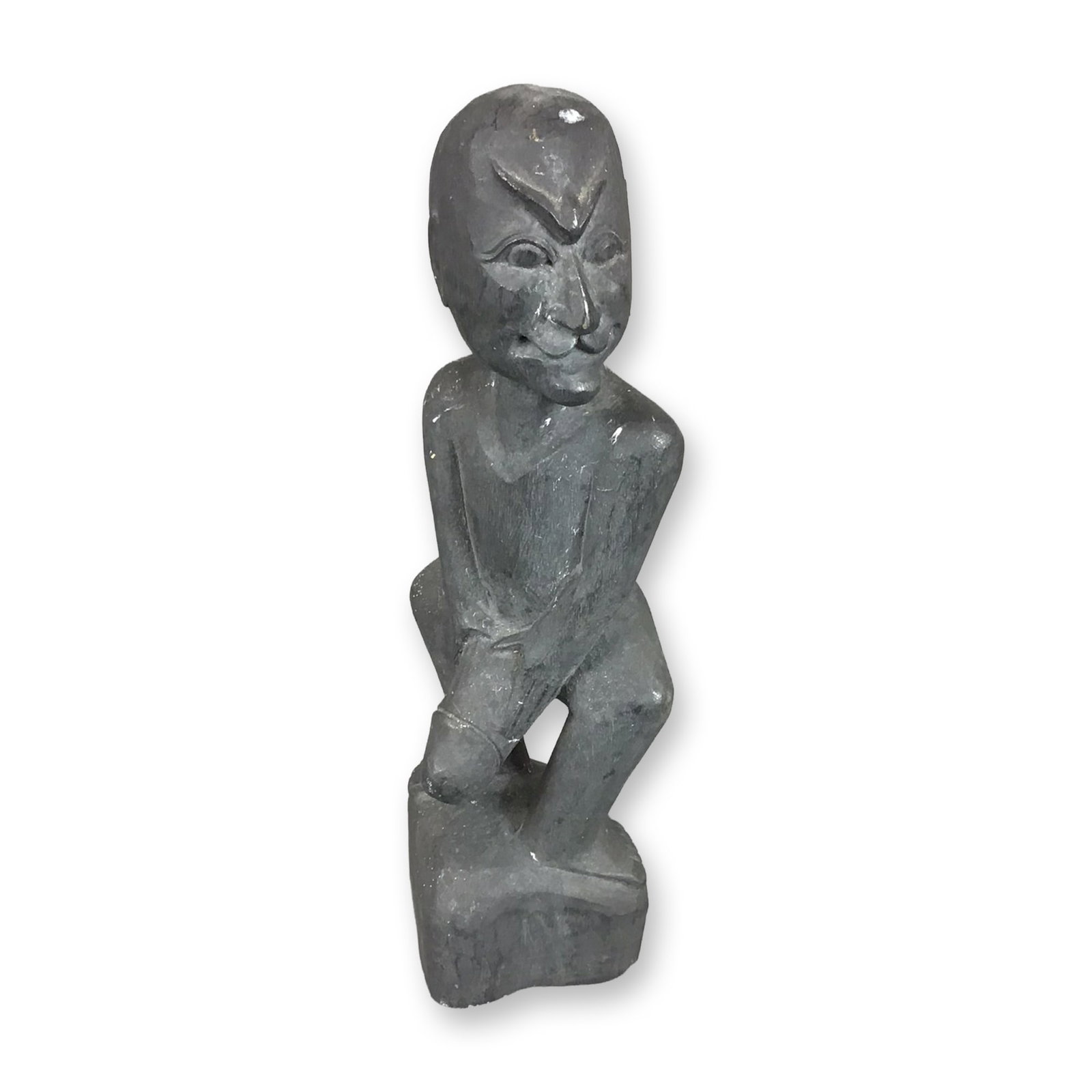 Carved Ebonized Wood Ithyphallic Male Figure in African Style: This hand-carved wooden figure is finished with a matte black ebonized stain. The object depicts a male figure in a squatting position on an integral base. The figure is rendered with an erect phallus