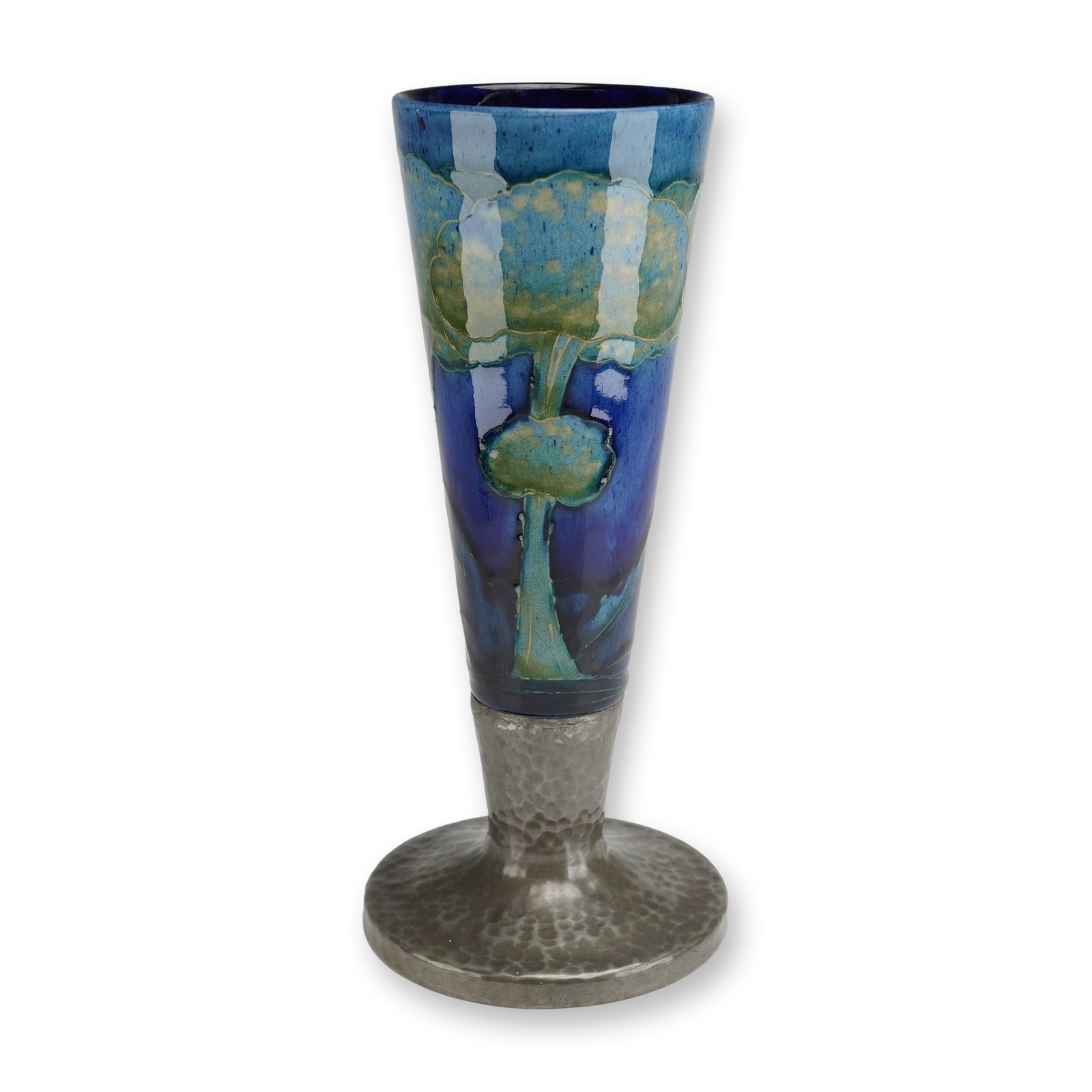 Moorcroft Pottery and Tudric Pewter Mounted Vase, Moonlit Blue: William Moorcroft floral vases decorated in the Moonlit Blue pattern, each fitted with Tudric pewter mounts. The bodies are decorated with characteristic tubelined floral motifs set against the deep, 