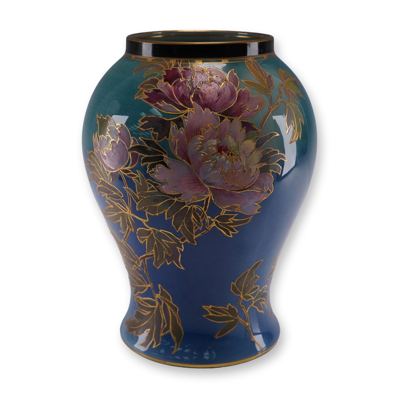 Royal Doulton Titanian Vase With Peonies and Bird: A Royal Doulton Titanian vase of baluster form, hand-painted with lush peony blooms and a bird in flight, rendered in shades of lavender, pink, and green against a deep cobalt and teal ground. The flo
