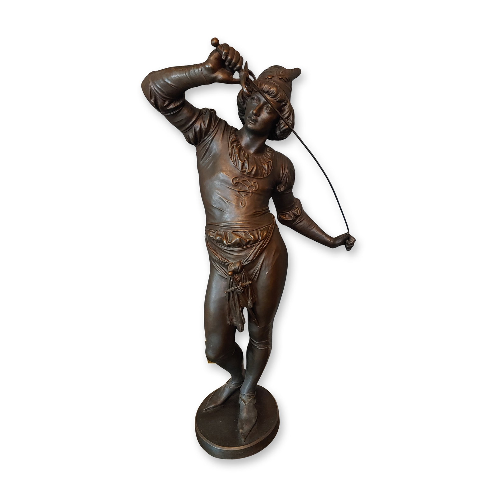 Ephraim Keyser (American, 1850-1937) Patinated Bronze Figure, Young Cavalier Straightening His: A late 19th-century patinated bronze figure depicting a dashing Renaissance cavalier, modeled by the acclaimed Baltimore sculptor Ephraim Keyser. The dynamic figure stands atop a circular integral bas