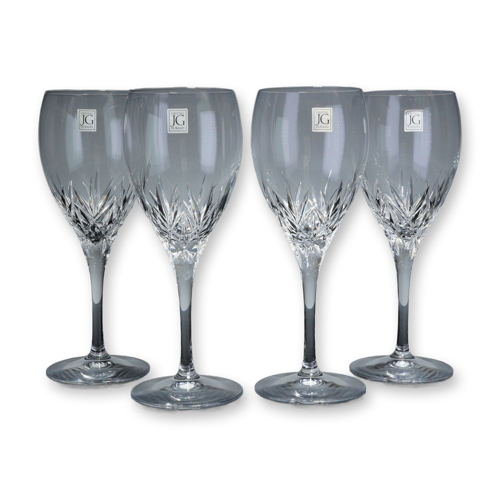 Set of Four JG Cristal Durand Cut Crystal Wine Glasses: This set of four wine glasses from JG Cristal Durand is crafted from clear cut crystal. Each glass features a tapered bowl decorated with a sharp, multi-faceted starburst cut pattern at the base,