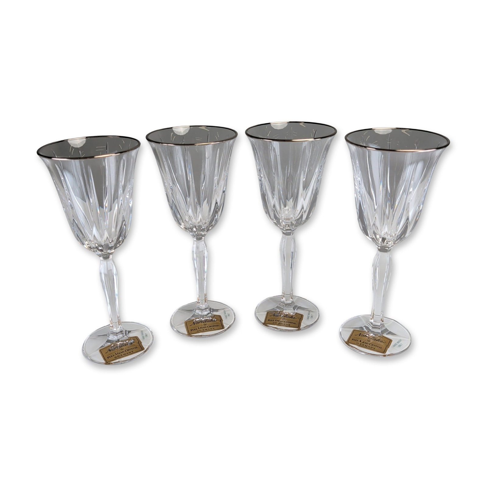 4pc Noritake Vendome Platin Crystal Wine Glasses: Noritake, Germany, set of four wine glasses in full lead crystal from the Vendome Platin pattern. Each glass features a clear bowl with deep vertical facet cuts, a platinum-toned rim, and a faceted he
