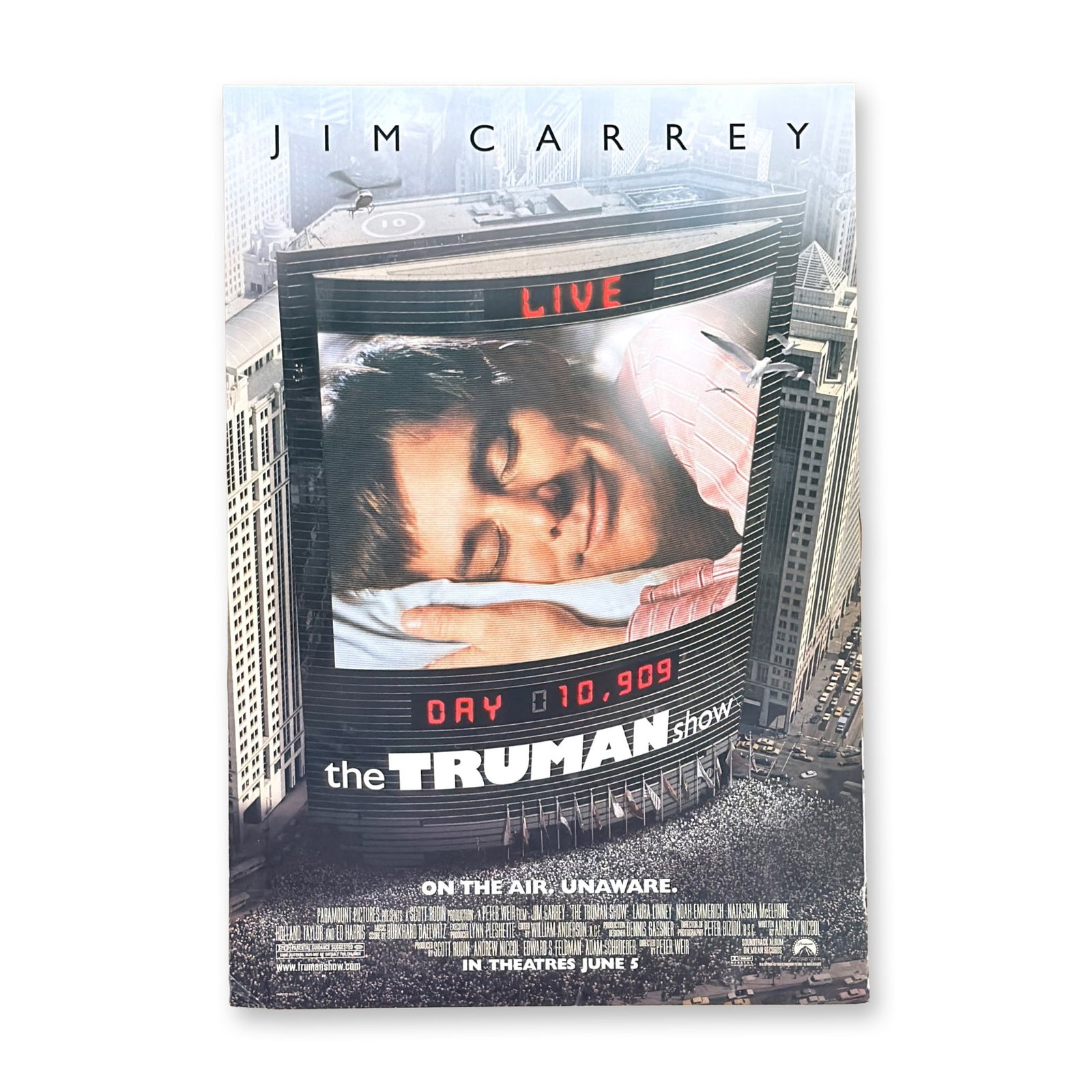 Original Double-Sided Teaser One-Sheet Movie Poster, The Truman Show Starring Jim Carrey/Peter Wier: Original advance teaser poster for the 1998 critically acclaimed masterpiece The Truman Show. This iconic "Mosaic" style teaser features a composite image of Jim Carrey's face made up of hundreds of t