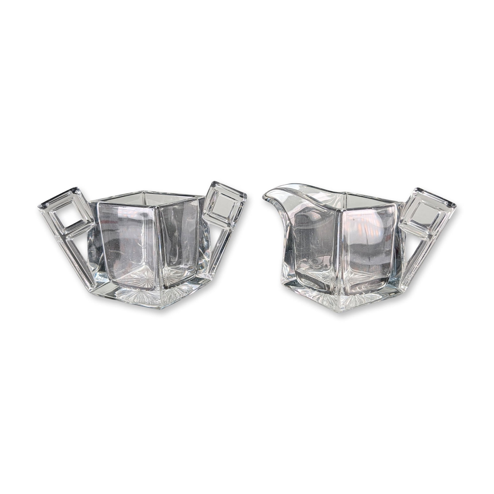 2pc August H. Heisey & Company Art Deco Clear Glass Sugar and Creamer: August H. Heisey & Company Art Deco Quator pattern pair of creamer and open sugar bowl, featuring clear pressed glass with geometric square-based bodies with tapering sides and right-angled architectu