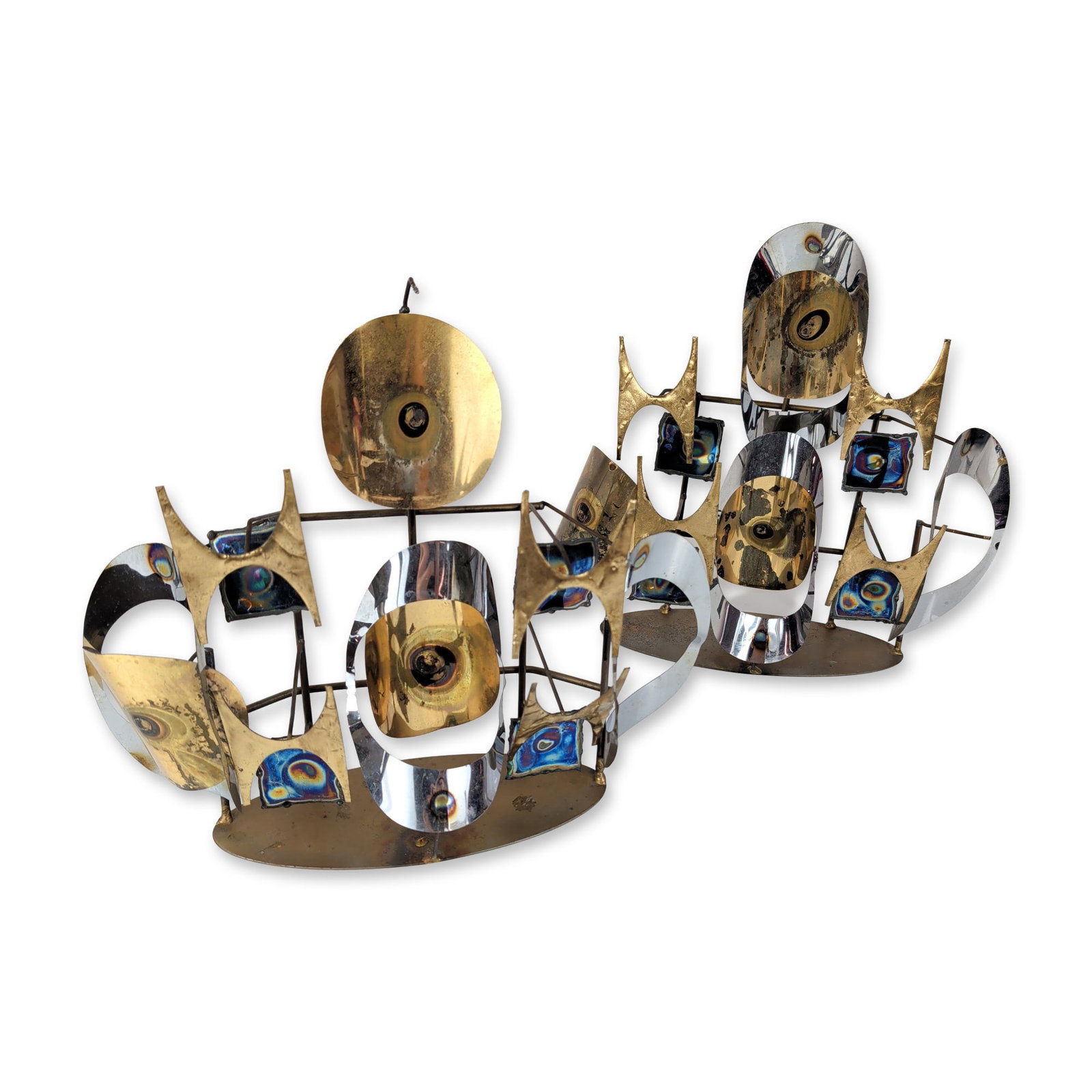 Pair of Modern Brutalist Mixed Metal Sculptural Candleholders: C. Jere (Artisan House), pair of Brutalist mixed metal tabletop sculptures, 1970. Each unit features a multi-layered abstract composition constructed from chrome-plated steel, brass, and torch-treated
