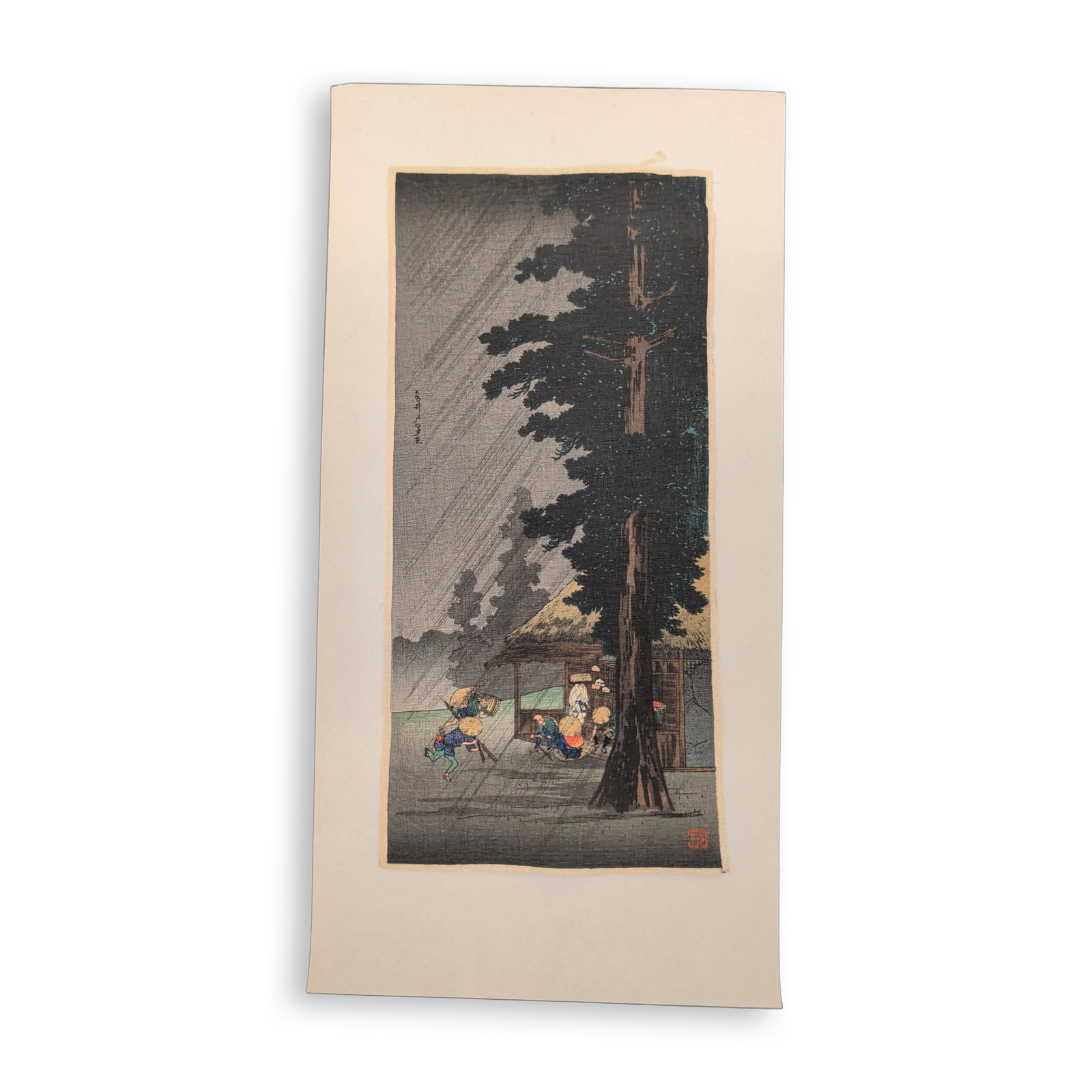 Takahashi Hiroaki (Japanese, 1871-1945), Woodcut on Paper, Sudden Shower at Takaido: Takahashi Hiroaki (Shotei) woodcut on crepe paper known as chirimen-e, titled Sudden Shower at Takaido. The composition depicts travelers and porters caught in a sudden torrential rainstorm at the Tak