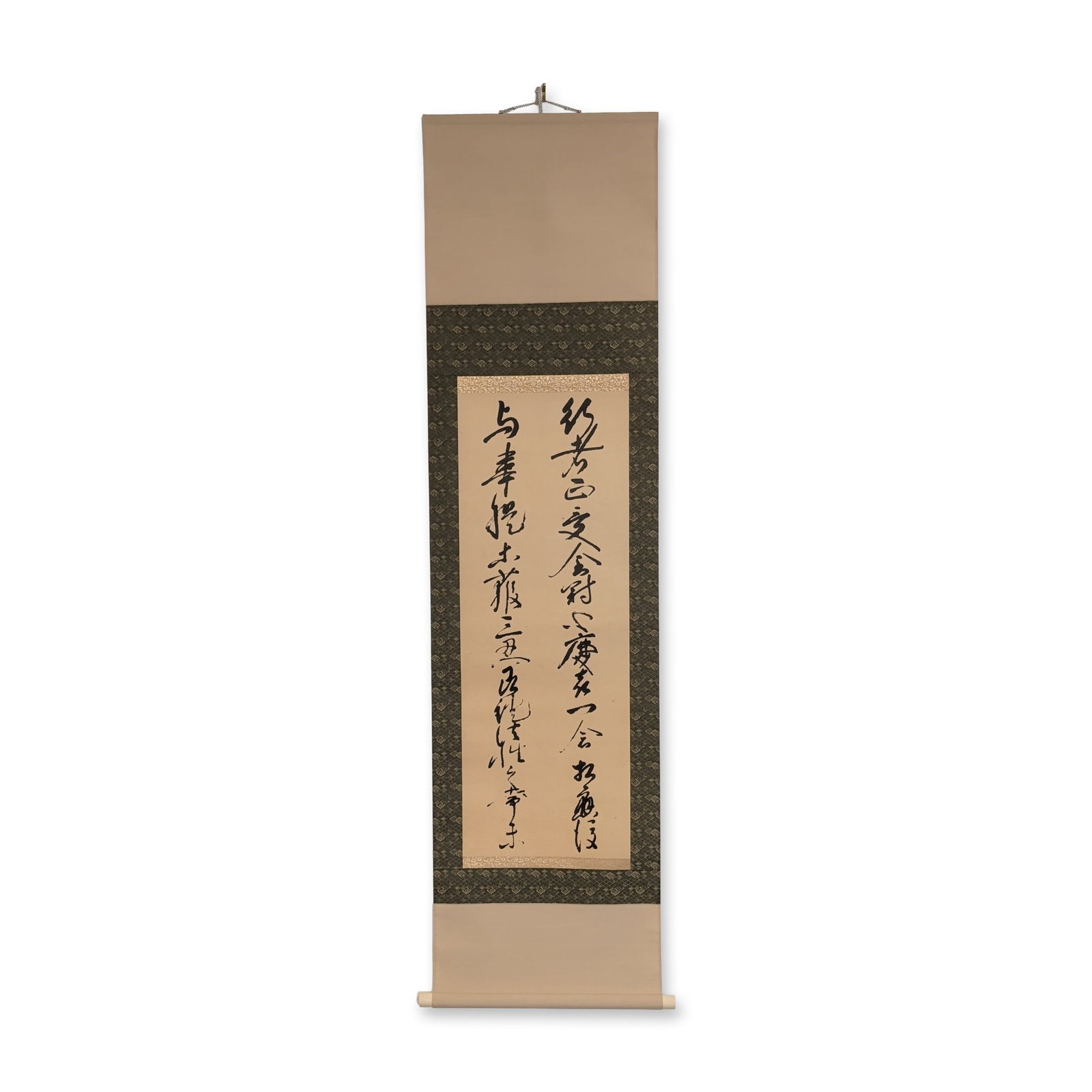 Japanese Calligraphy Ink on Paper Hanging Scroll: Japanese hanging scroll featuring two lines of calligraphy in black ink on paper. The text is executed in a highly stylized cursive script. The work is professionally mounted with silk brocade borders