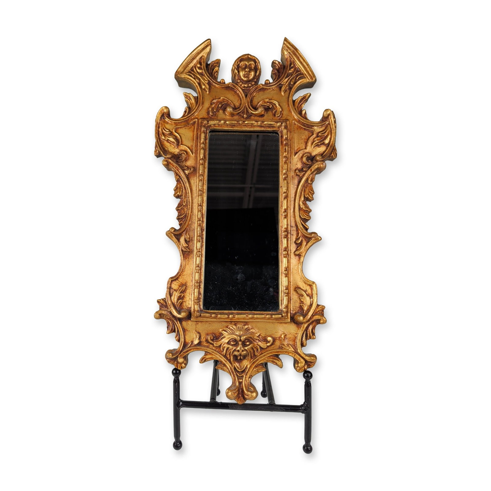 Italian Baroque Style Carved Giltwood Putti and Lion Mirror: This wall mirror features an elaborate Florentine Baroque revival style frame designed with dramatic architectural contours and openwork details. The molded perimeter is decorated with flowing scrollw