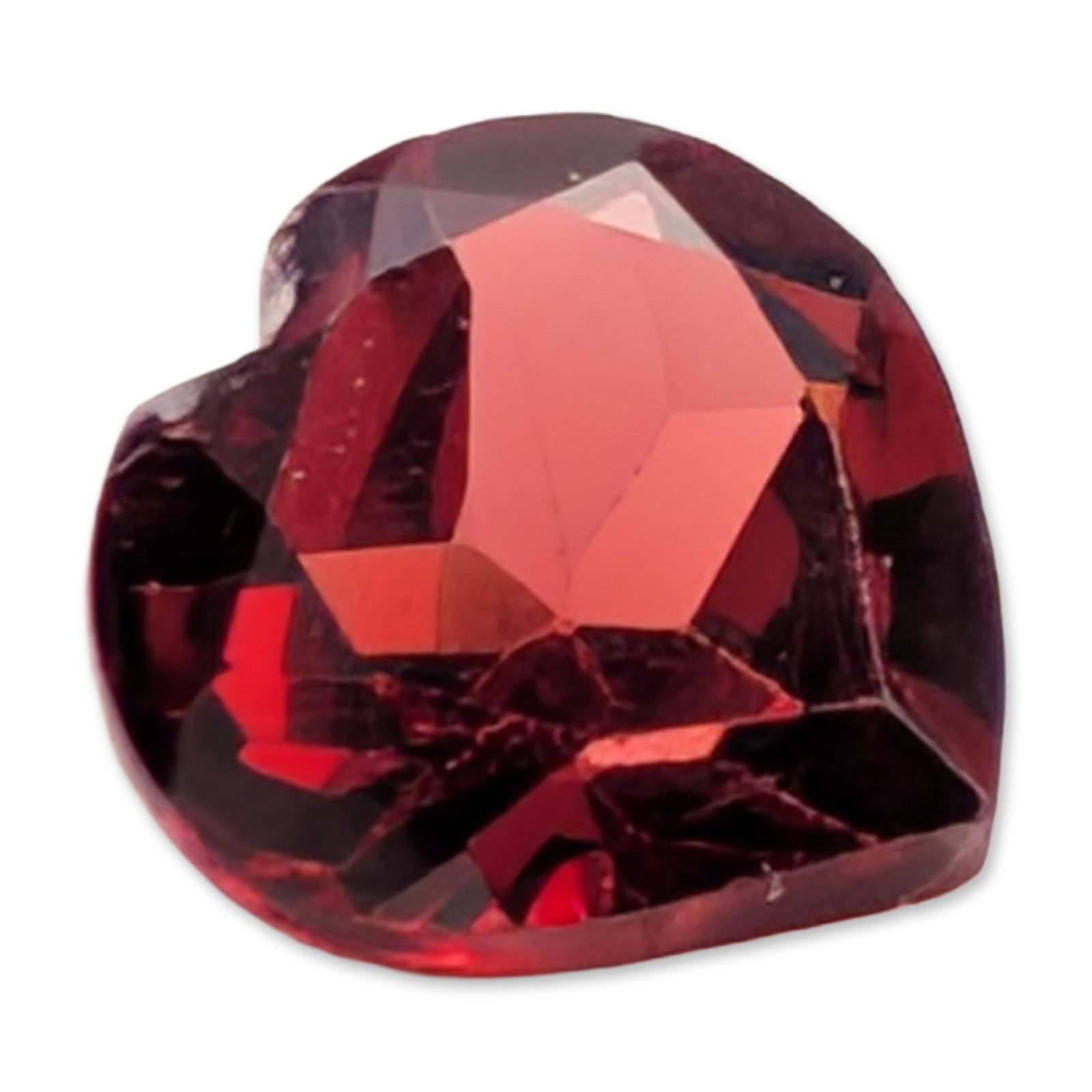 Red Garnet Heart Cut Loose Garnet Gemstone: Loose red garnet gemstone, featuring a faceted heart shape with a saturated deep red color and transparent clarity. No laser inscriptions or maker marks visible. 0.8ct Dimensions: 5.7H MM