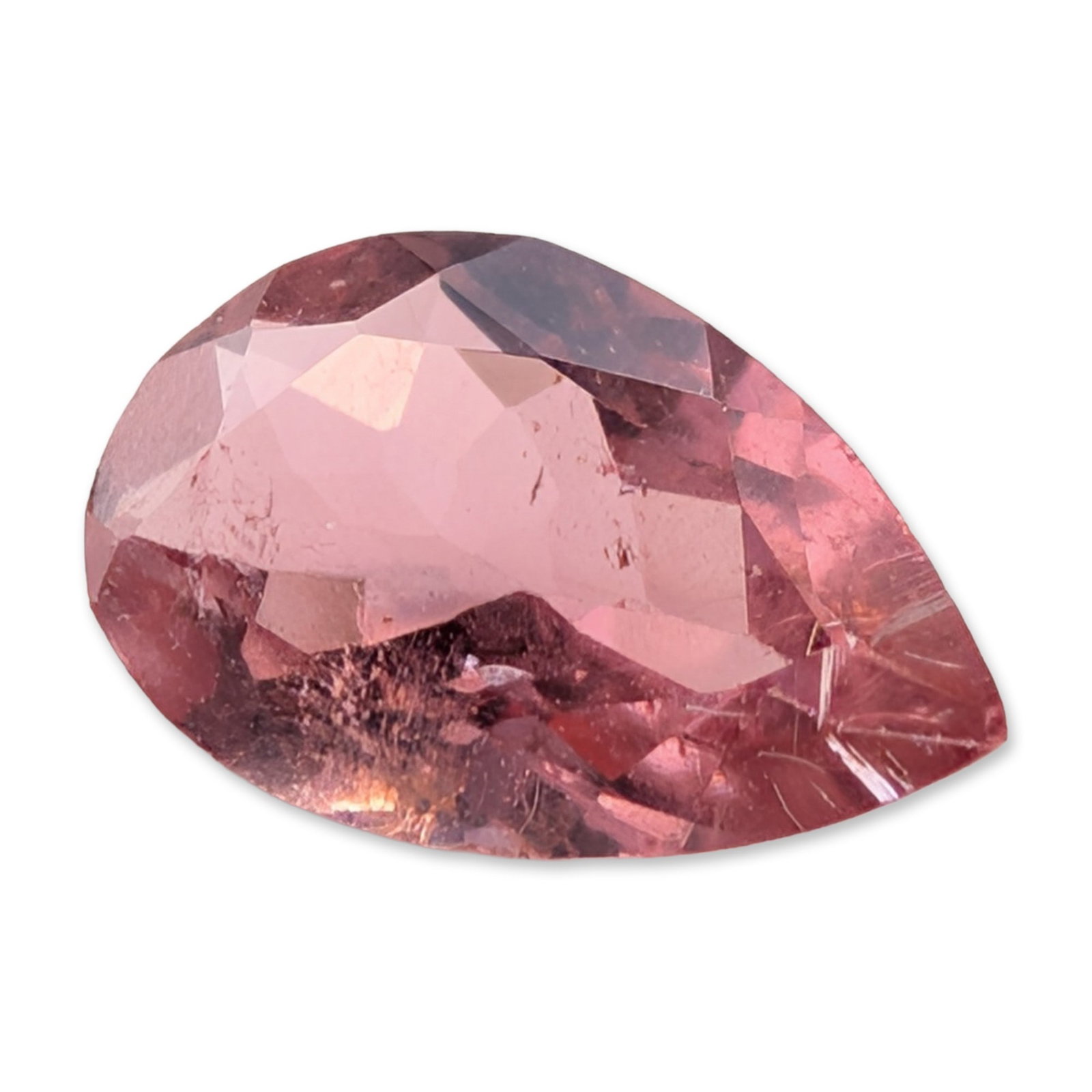 Faceted Pear Cut Pink Tourmaline Loose Gemstone: A loose faceted gemstone which appears to be pink tourmaline. The stone features a pear-cut shape with a medium pink hue and subtle warm undertones. It is transparent to translucent, displaying charac