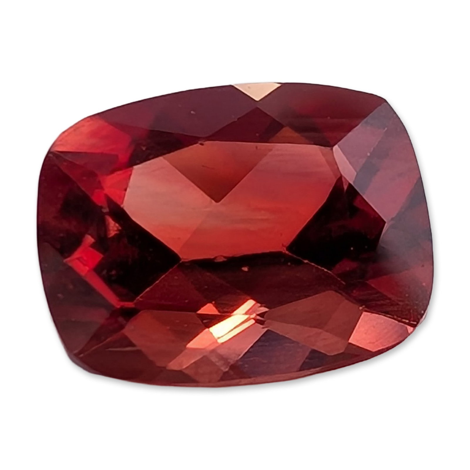 Faceted Red-Orange Cushion Cut Stone: Loose faceted stone characterized by a saturated orangey-red hue. The stone features a modified cushion cut with a deep pavilion and sharp facet junctions. Weight: 1.80 ct. Dimensions: 8.9H MM