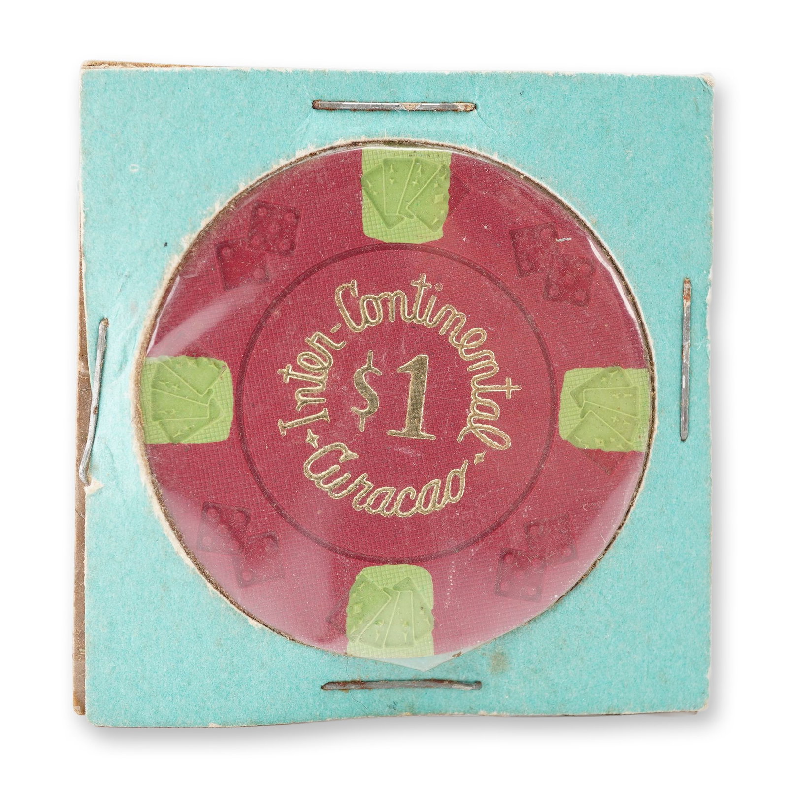 Inter-Continental Curacao Casino 1 Dollar Token: Features a red composite body with embossed green inserts showing playing cards and dice motifs. The obverse and reverse display the inscription INTER-CONTINENTAL CURACAO 1 dollar in gold lettering. T