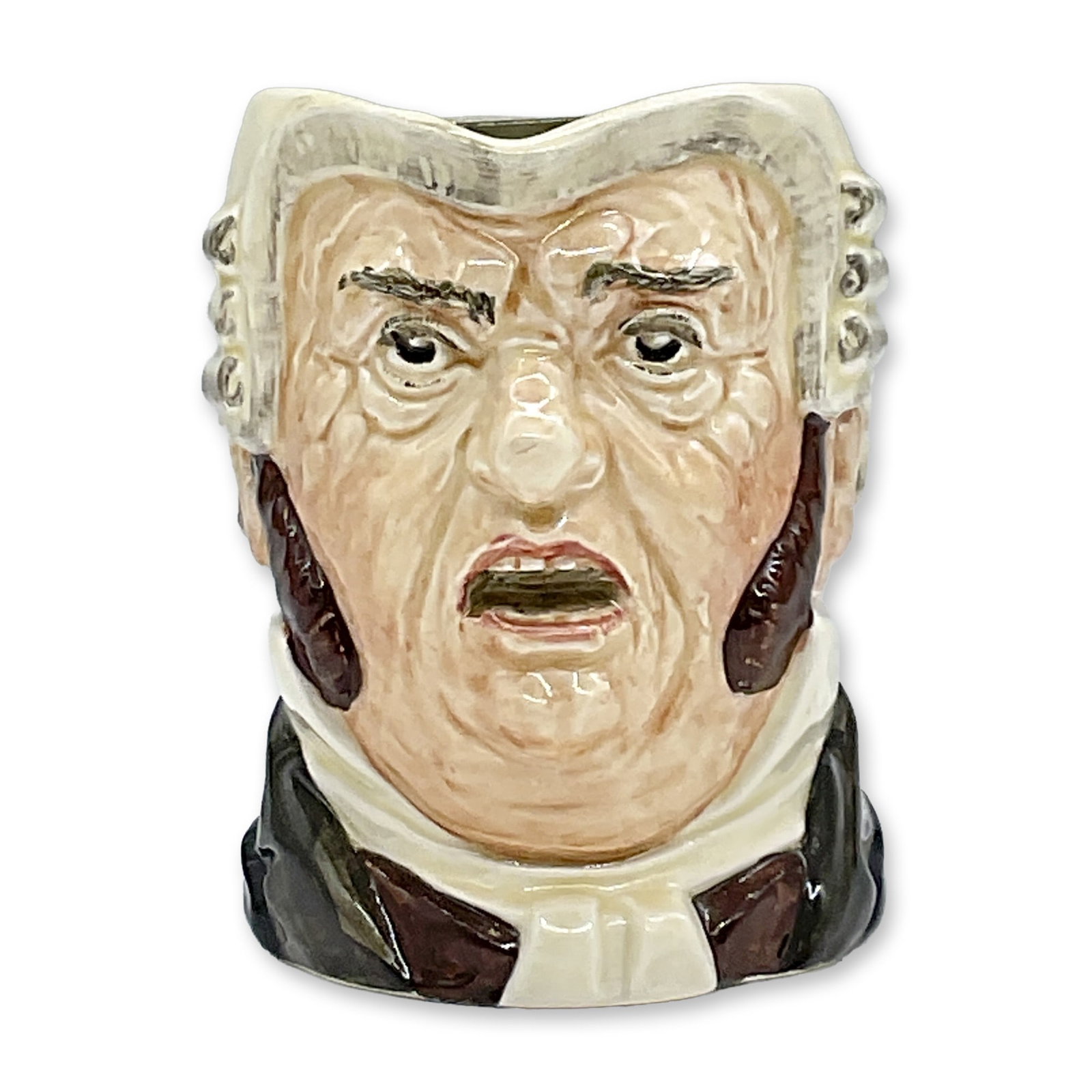 Royal Doulton Mid Size Character Jug, Buz Fuz D5838: This mid size glossy character jug features a white collar, brown waistcoat, dark green coat and black robe. Royal Doulton Backstamp. Dimensions: 5"L x 3.5"W x 4.25"H Date or Era: 1938 - 1948 Manufact
