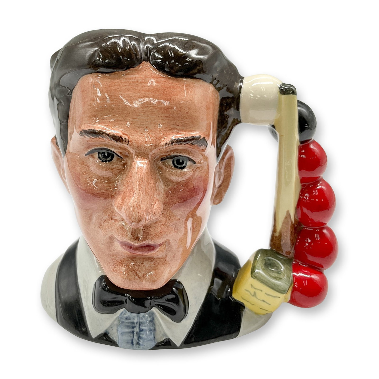 Snooker Player D6879 - Small - Royal Doulton Character Jug: Black hair; white shirt; black bow tie and vest. Royal Doulton backstamp. Artist: Stanley J. Taylor Dimensions: 4"H Date or Era: 1991 - 1995 Manufacturer or Brand: Royal Doulton Country of Origin: