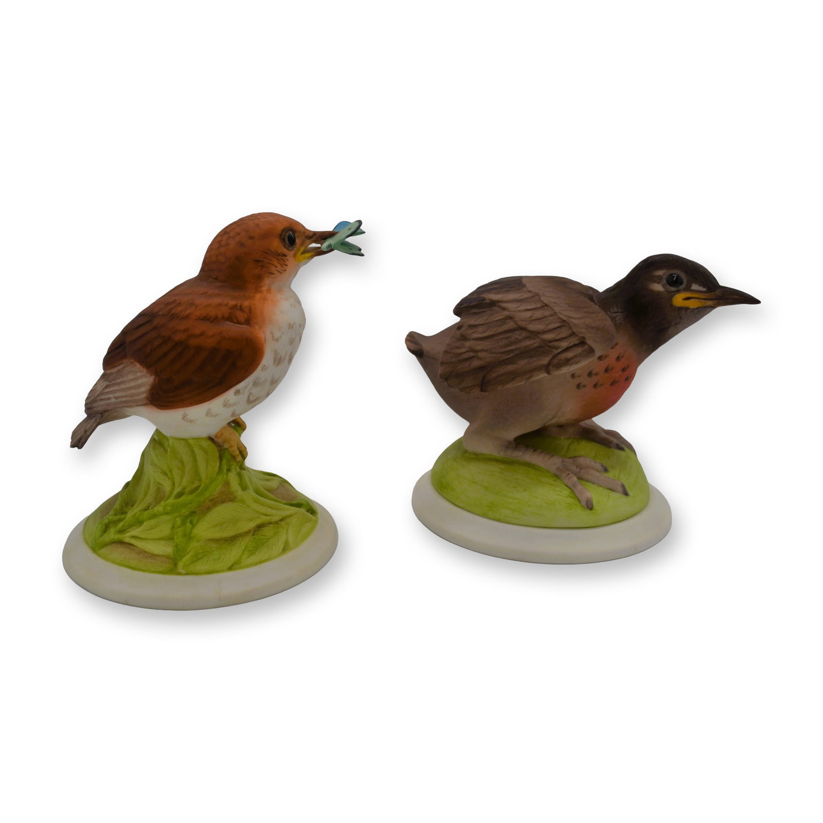 2Pc Boehm Porcelain Baby Wood Thrush and Baby Robin Bird Sculptures, 1957: Bisque Porcelain Decorated, hand created, hand painted by Mr. Ed Boehm and the Artists at the Boehm Studios in Trenton, New Jersey, USA. Featuring the 1) Baby Wood Thrush with Butterfly on a circular 