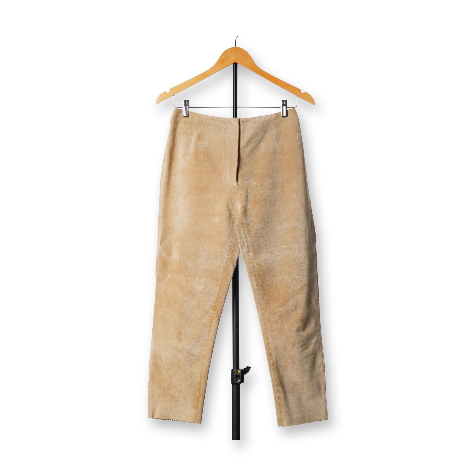 Revue Women's Tan Suede Leather High-Waisted Pants: A pair of high-waisted trousers by Revue. The garment is constructed from tan suede leather in a straight-leg silhouette. The design features a minimalist clean-front without pockets and includes