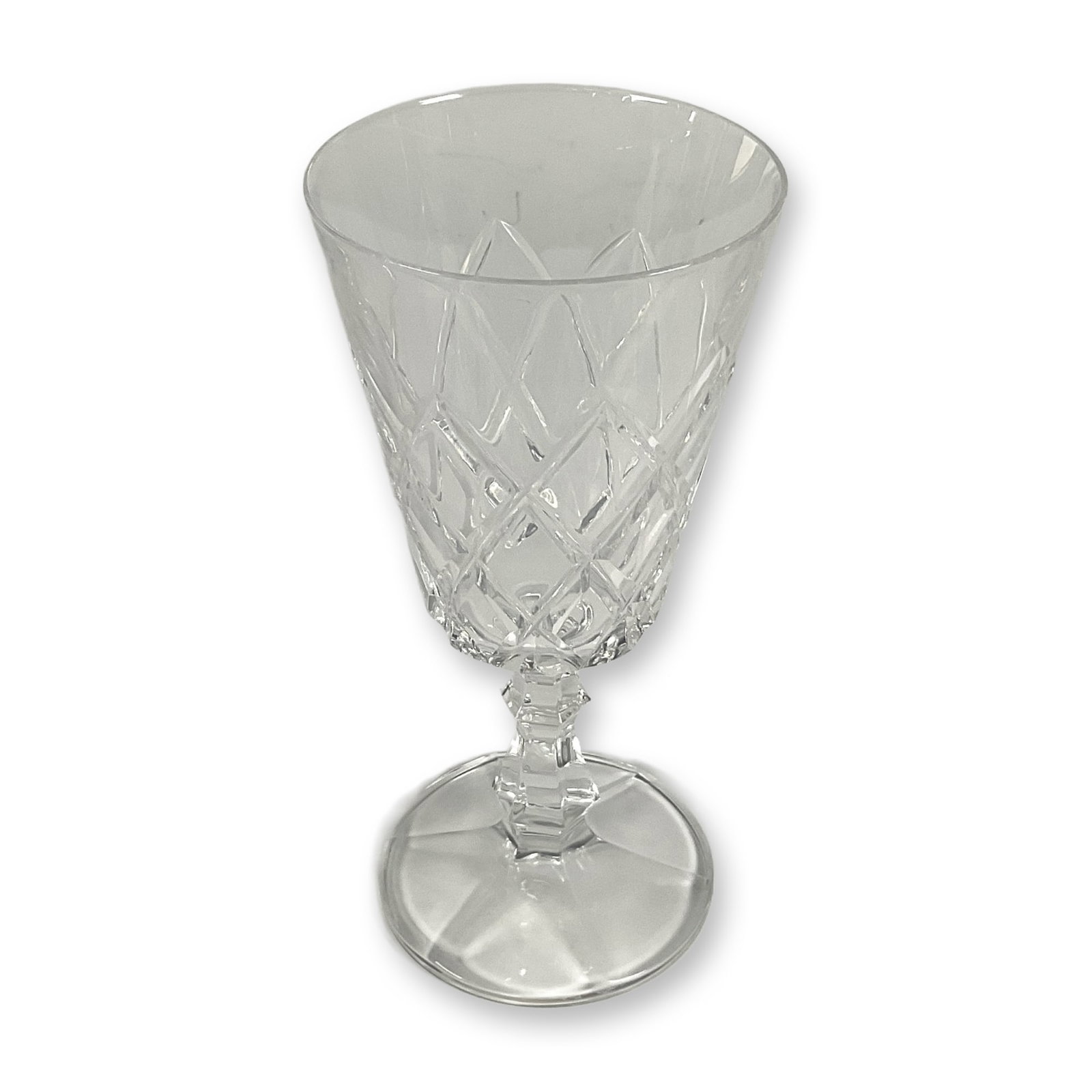 Crystal Wine glass: Exquisite Irish crystal glassware featuring intricate and elegant patterns, including dazzling diamond and star shaped cuts. Unmarked. Dimensions: 3.5"L x 6.75"H