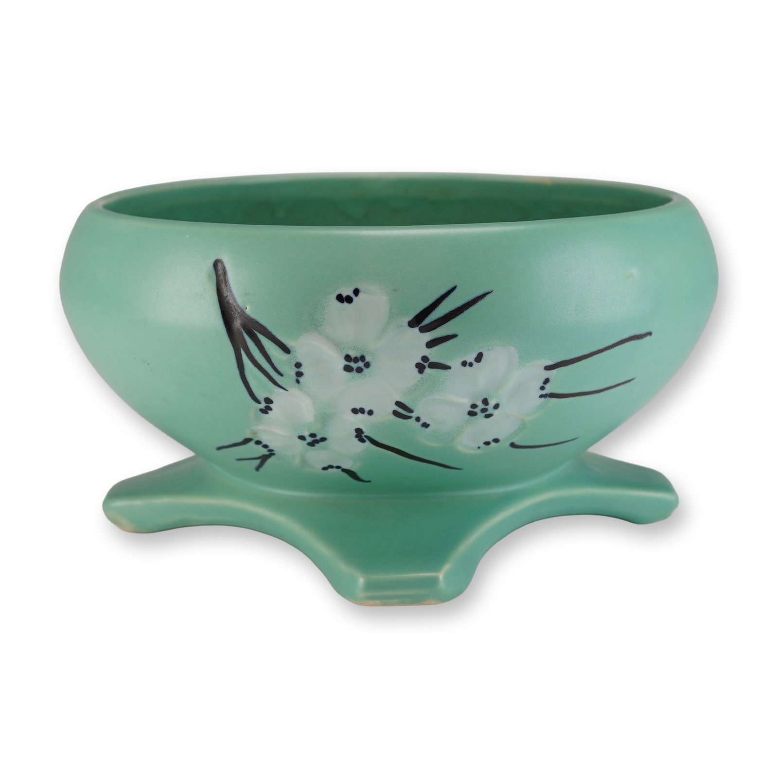 McCoy Springwood Pattern Footed Planter in Mint Green Glaze: A single vintage McCoy Green Footed planter, identified as the Springwood pattern. This ceramic vessel features a wide, rounded body resting on four splayed, triangular feet. The exterior is finished