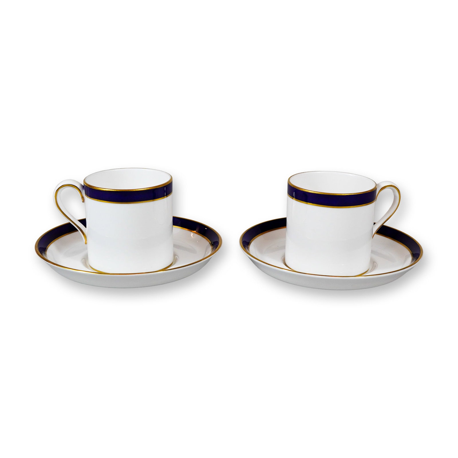 4pc Spode Consul Coffee Sets: Spode, England. A grouping of two sets of coffee cans with matching saucers in the Consul pattern, number Y7332. Constructed from bone china, each piece features a white field decorated with a wide co