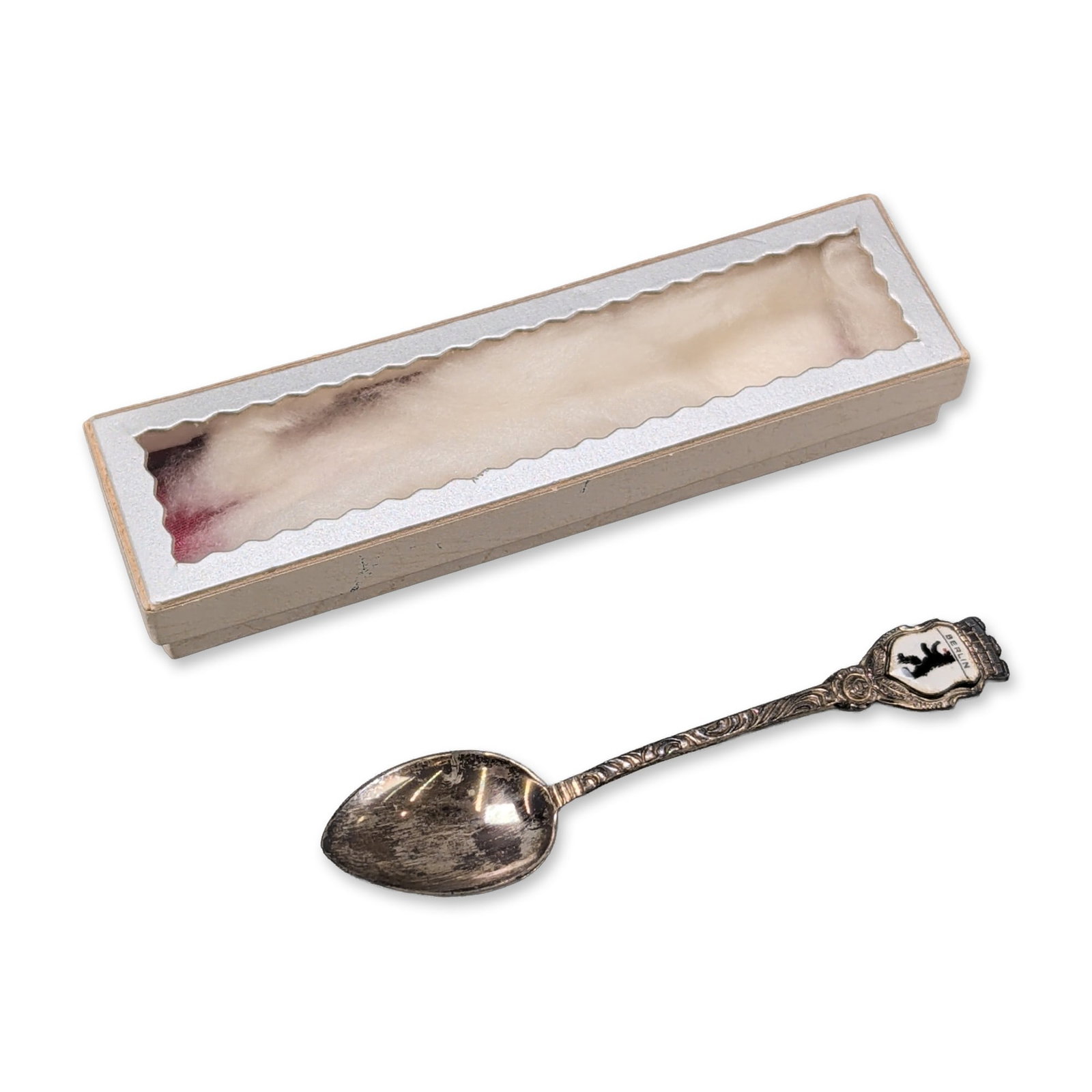German .800 Silver Berlin Souvenir Spoon: Antiko German souvenir demitasse spoon in .800 fine silver. The finial features an enameled shield with a white ground depicting the Berlin Bear in black with red accents, surmounted by a