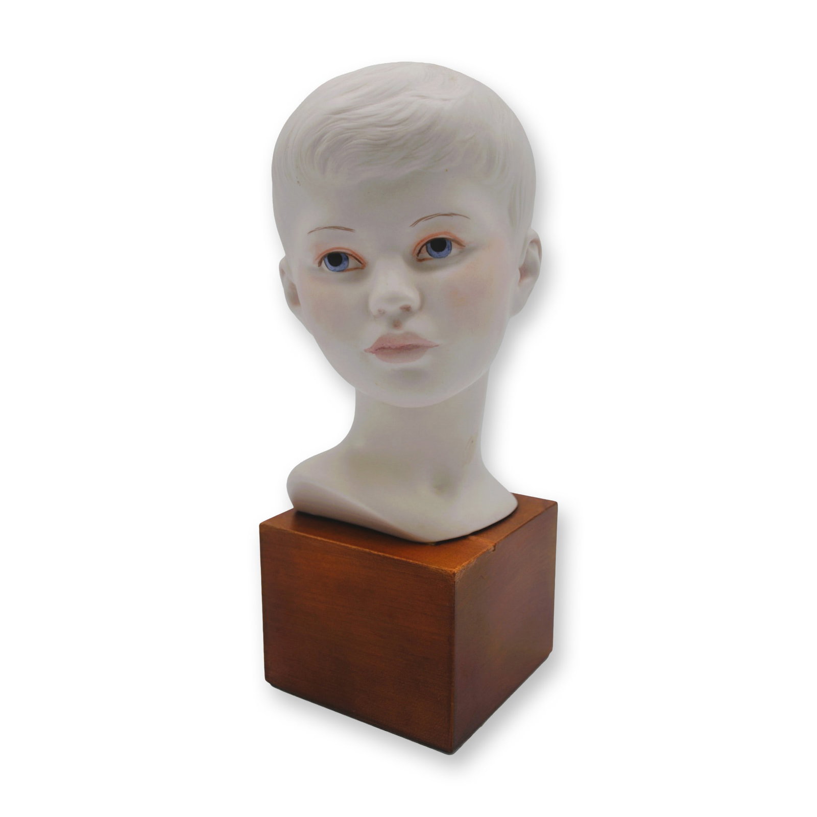 Cybis Porcelain Head of Young Boy Sculpture On Wood Plinth, 1968: Bisque Porcelain Decorated, hand created, hand painted by the Artisans of the Cybis Studios in Trenton, NJ, USA. Featuring the Head Bust of a Young Boy on a Wood Plinth from The Chidren to Cherish
