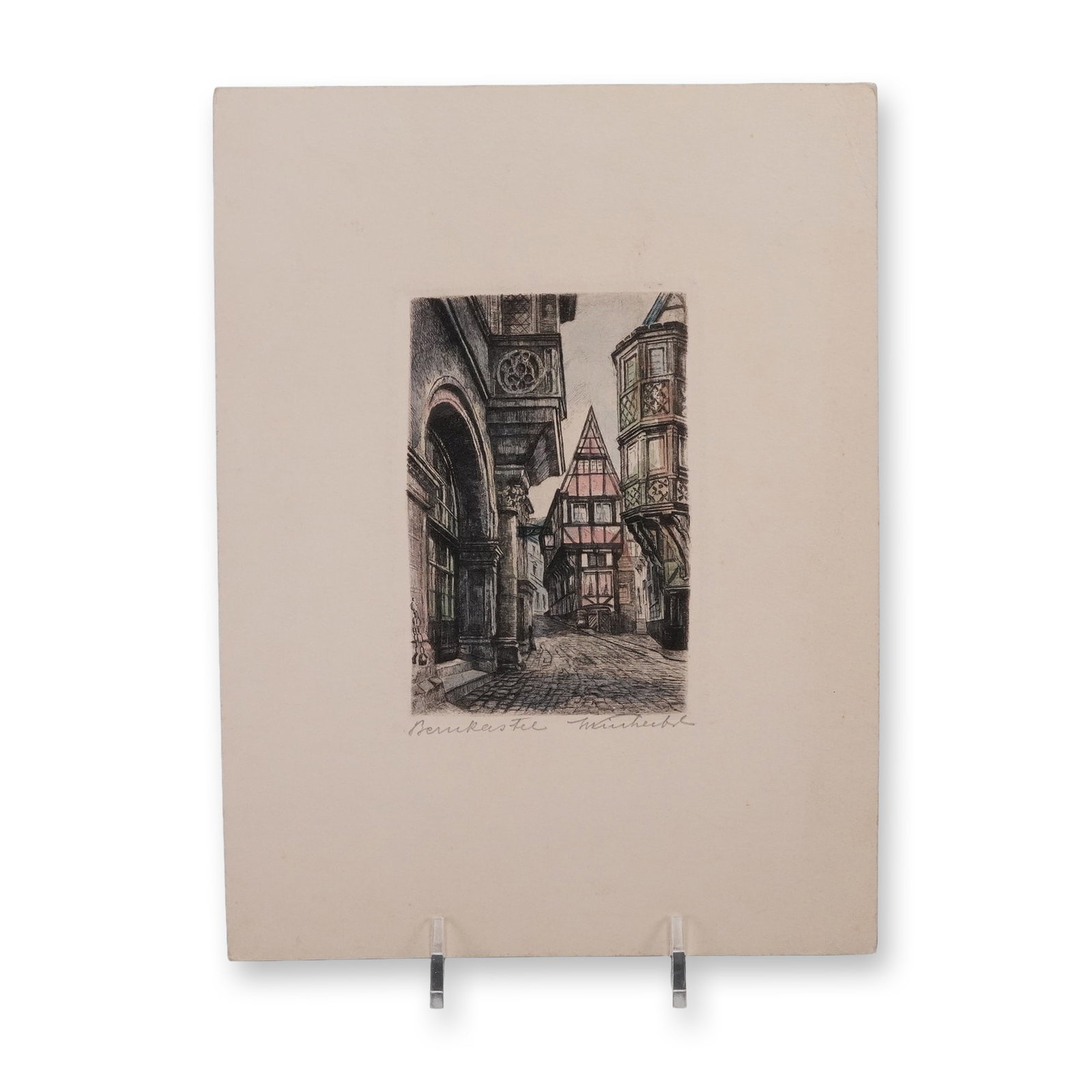 Hans Klemke Hand-Colored Pressing of Bernkastel: A hand-colored intaglio pressing by German graphic artist Hans Klemke (1892-1960), depicting a picturesque street scene in the town of Bernkastel along the Moselle River. The finely detailed compositi