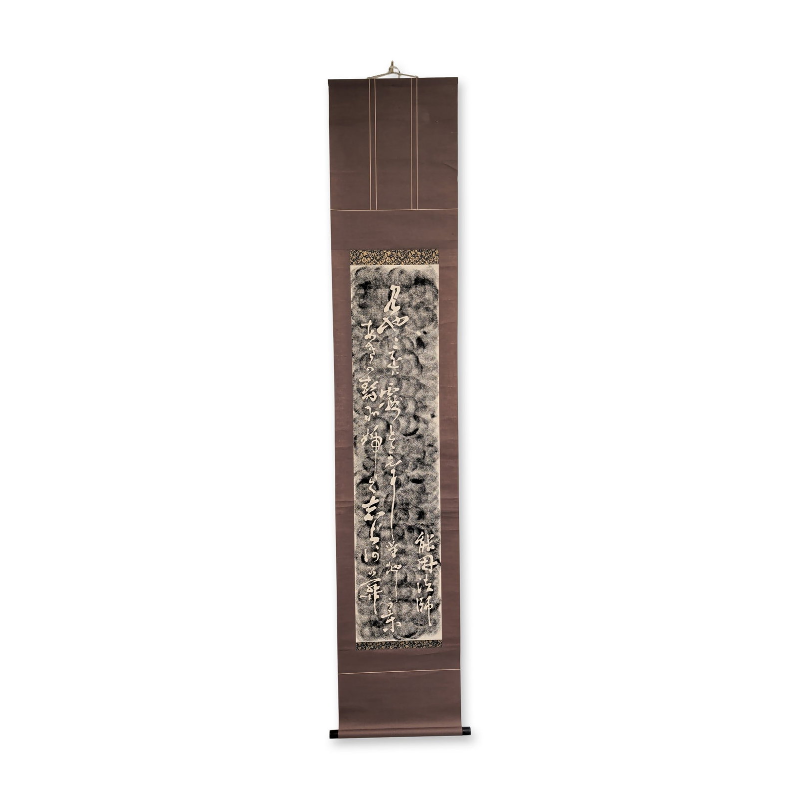 Japanese Takuhon Style Calligraphy Hanging Scroll: Japanese hanging scroll featuring calligraphy in the takuhon style. The central panel displays white cursive script against a mottled black and grey ink background, simulating the appearance of a ston