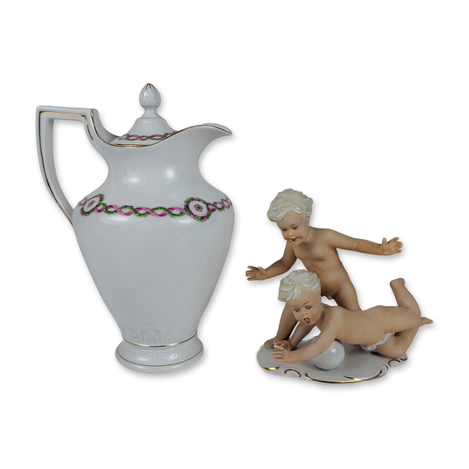 Two German Porcelain Decorative Objects: This elegant German porcelain pairing features a hand-painted vignette of two matte-finished blonde putti balancing atop a gilded sphere over a glazed rococo base. Accompanying the figure is a