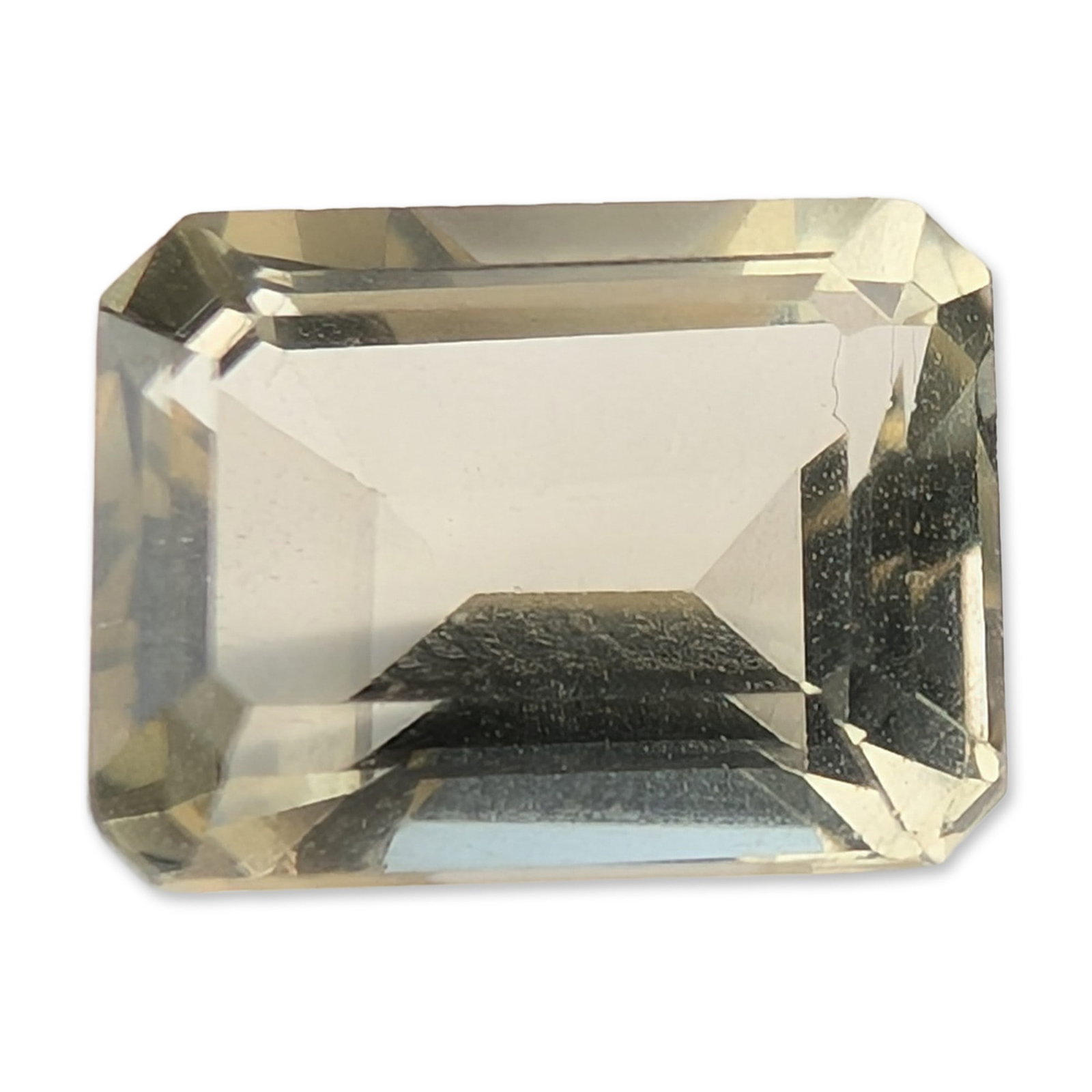 Emerald Cut Pale Yellow Loose Citrine Gemstone: Emerald cut loose citrine gemstone, featuring a rectangular step-cut form and transparent body. Weight: 1.7 carats. Dimensions: 6 x 8.4mm Dimensions: 6"W x 8.4"H x 8.4mm