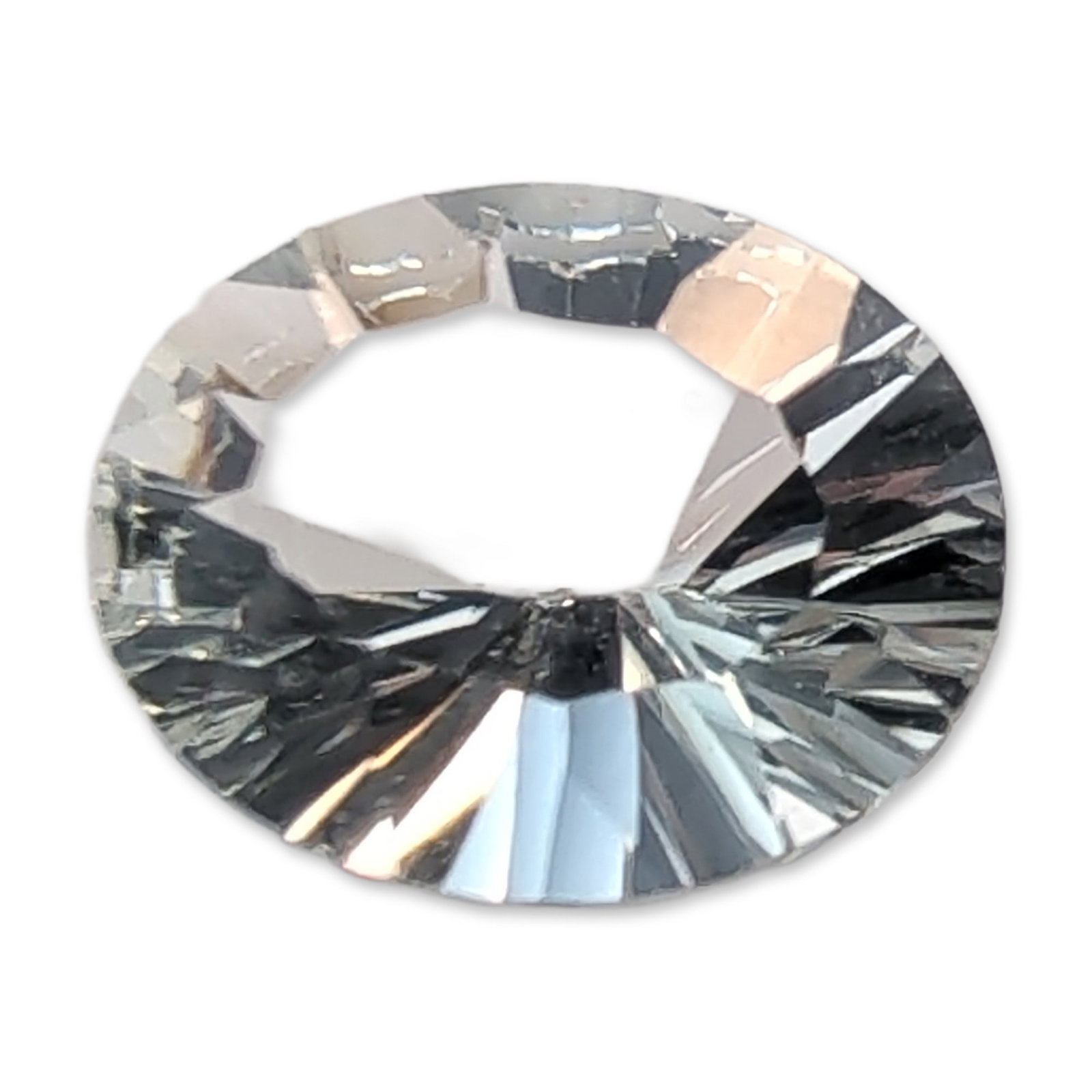 Colorless Oval Concave Cut Faceted Quartz Gemstone: A faceted quartz gemstone in a colorless material. The oval-shaped stone features a specialized concave-faceted pavilion that creates a radiating optical effect, paired with a traditional crown and fl