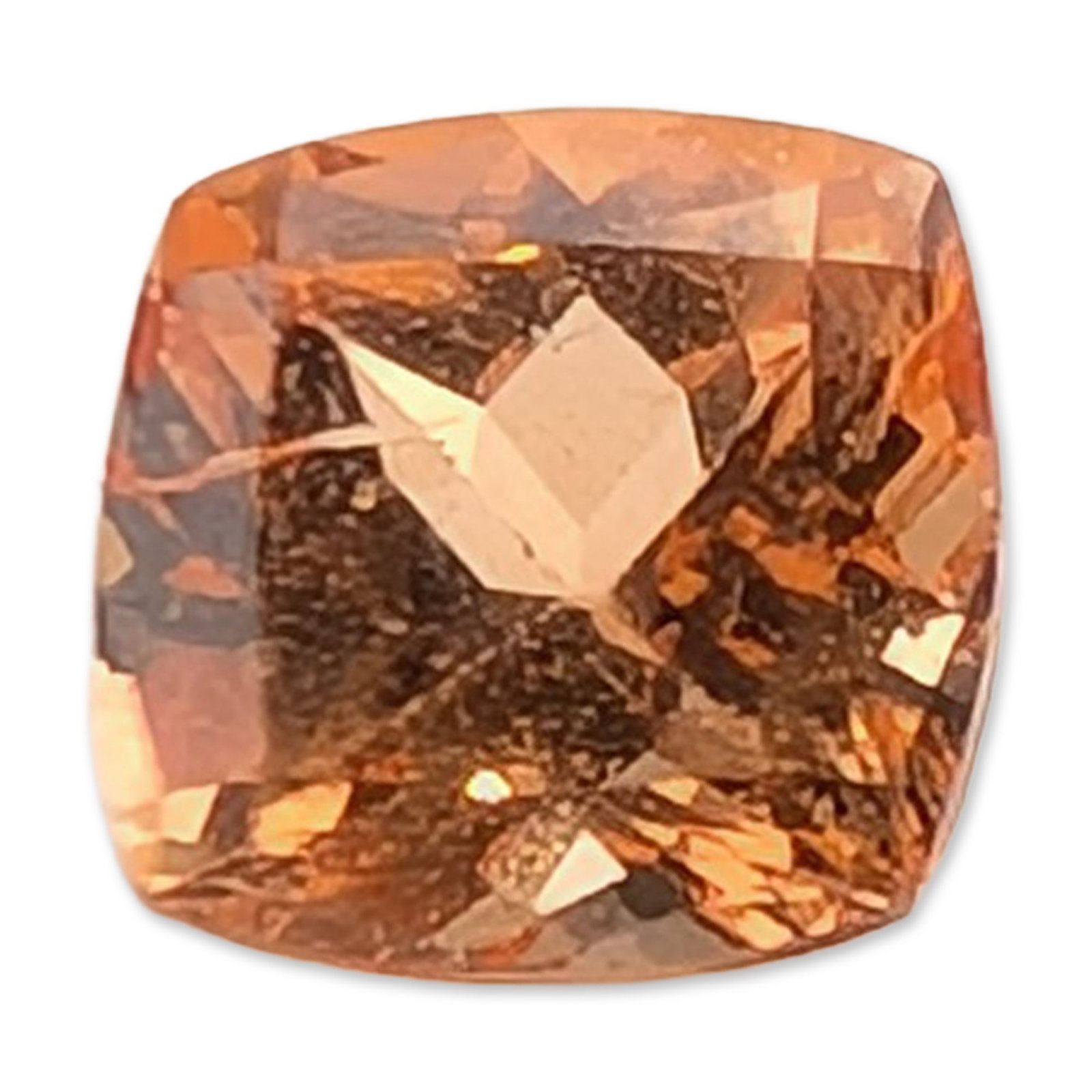Orange Cushion Cut Loose Gemstone: Loose faceted gemstone featuring a cushion cut with a modified brilliant facet arrangement. The stone displays a saturated champagne to peach-orange hue with golden secondary flashes and high