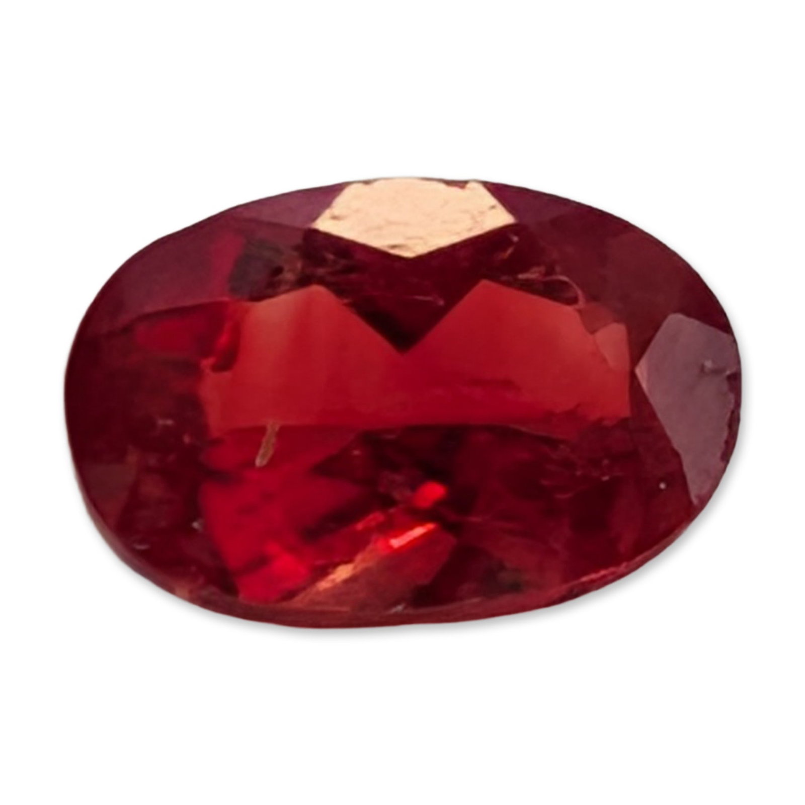 Loose Oval Mixed Cut Red Stone: Loose, faceted red stone in an oval mixed cut. The stone features a brilliant-style crown over a deep faceted pavilion. It exhibits a highly saturated, vibrant red hue with pinkish undertones.
