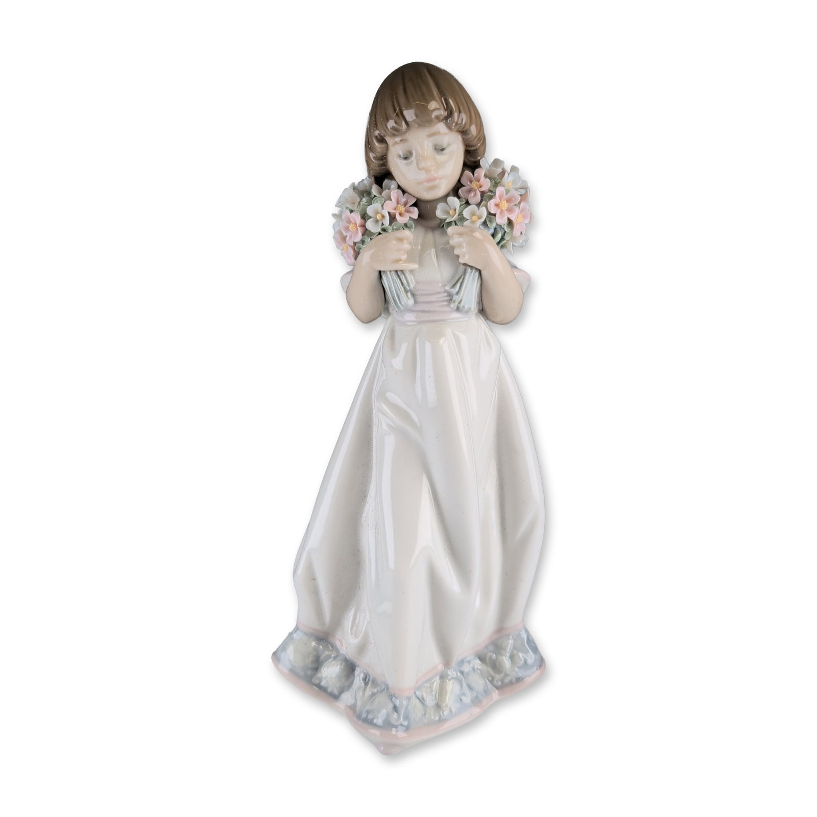 Lladro Collectors Society Porcelain Figurine, Spring Bouquets 1007603: Depicting a young girl in a full-length flowing white gown with pale blue and pink ruffled detailing at the cuffs and hem, clutching two bouquets of delicate handmade flowers. The underside bears the