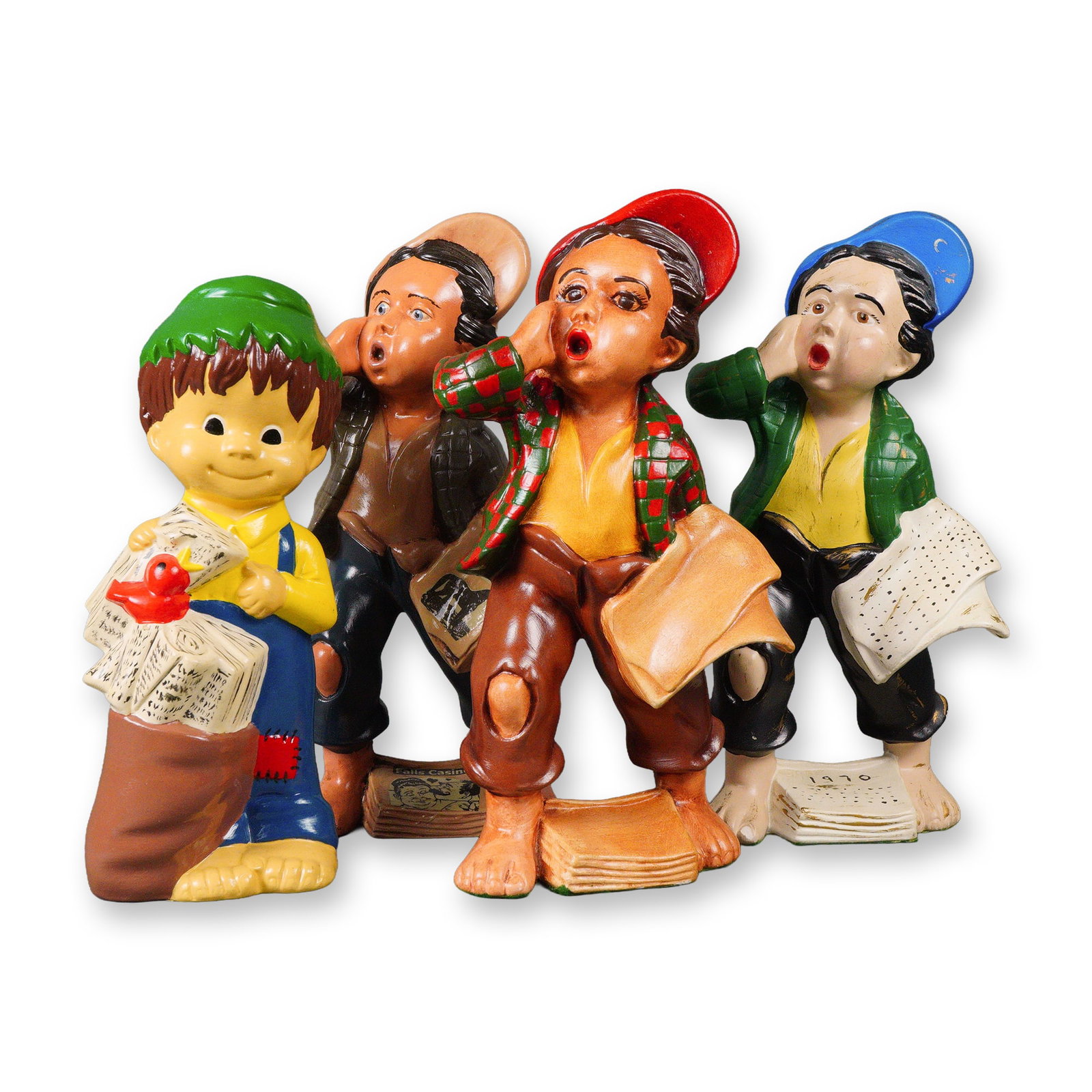 A Group of Four Ceramic Newspaper Boy Figurines, N. Cox, Dated 1970: Three figures depict expressive young newsboys with bare feet, tattered clothing, and colorful caps, caught in dynamic poses as if shouting and holding newspapers. The fourth figure is a more stylized