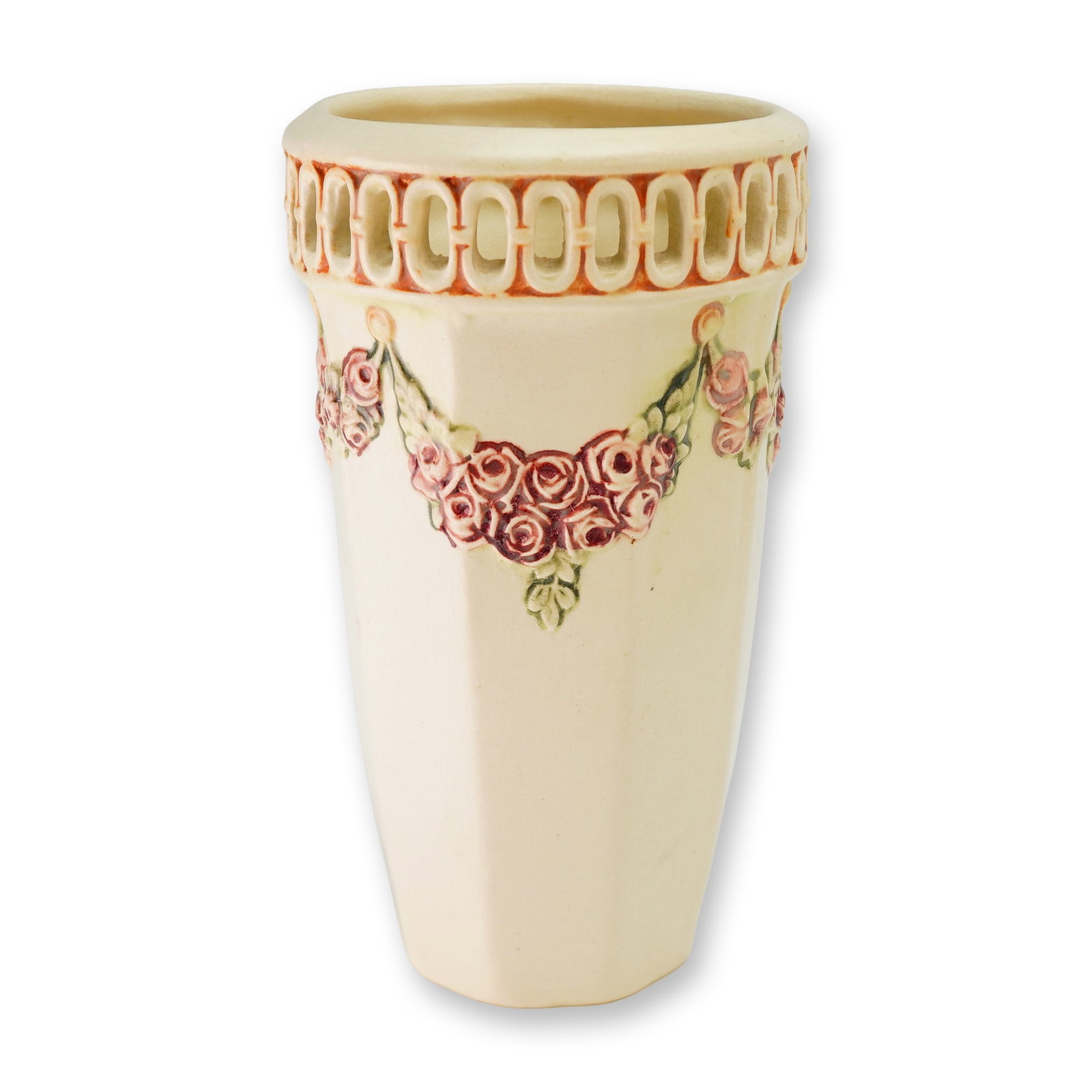 Weller Pottery Roma Pattern Octagonal Rose Swag Vase: A Weller Pottery ceramic vase from the Roma line, manufactured in Zanesville, Ohio, circa 1914-1920. The vessel features a tapering octagonal body finished in a matte cream glaze. The exterior is orna