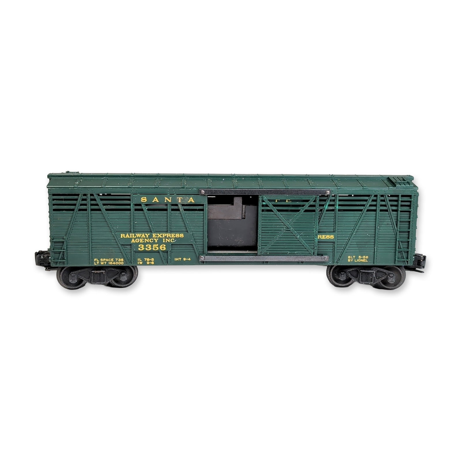 Lionel 3356 Santa Fe Railway Express Horse car: Lionel 3356 Santa Fe Horse car in dark green plastic, featuring yellow heat-stamped lettering. The side paneling is marked "Santa Fe" above "Railway Express Agency Inc." and the model number "3356". A