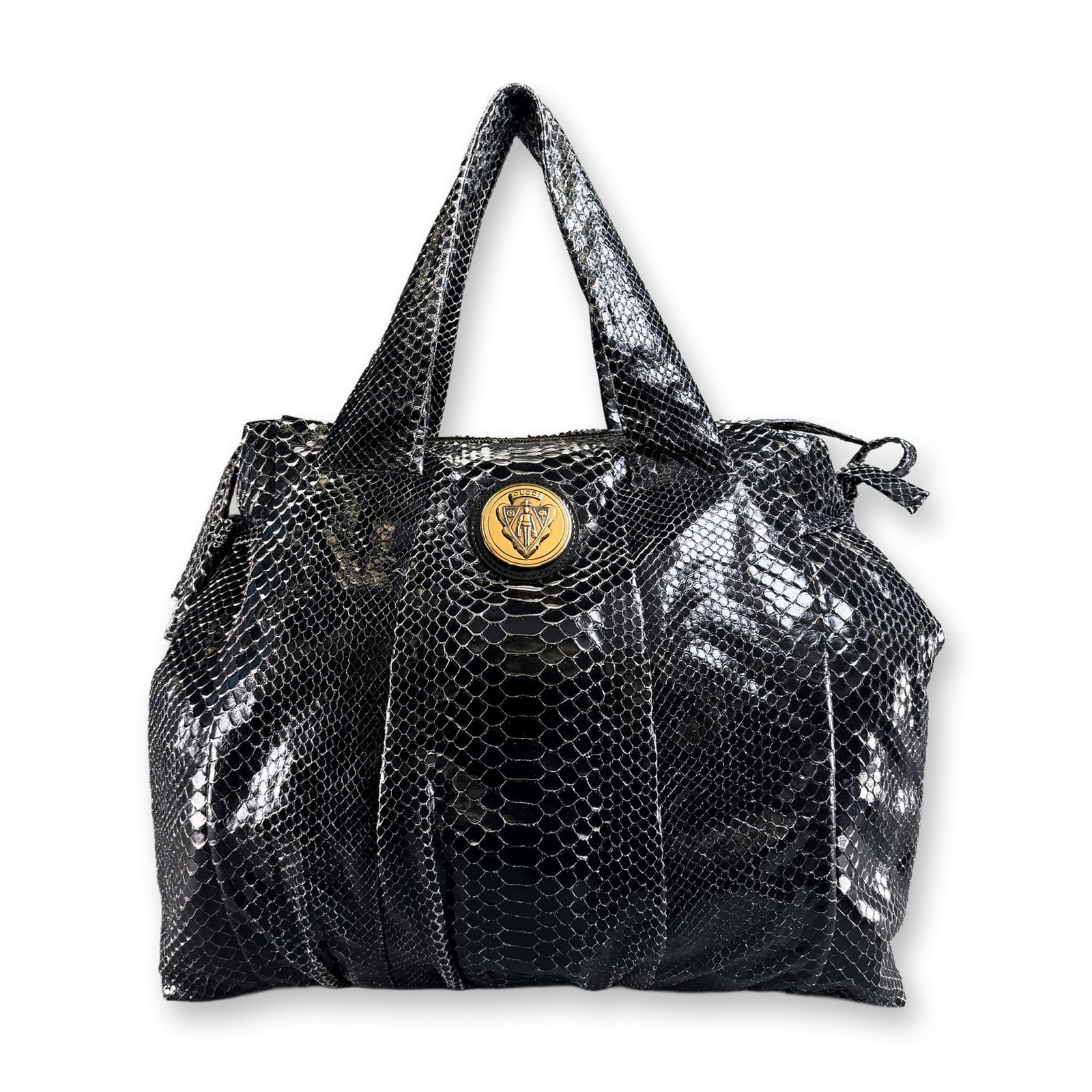 Gucci Italy Hysteria Large Python Leather Tote w/ COA: An Italian-made Gucci Hysteria large tote bag in black glossy python skin with leather trim and gold-tone hardware. The front is set with a circular medallion featuring the Gucci crest and name. The i