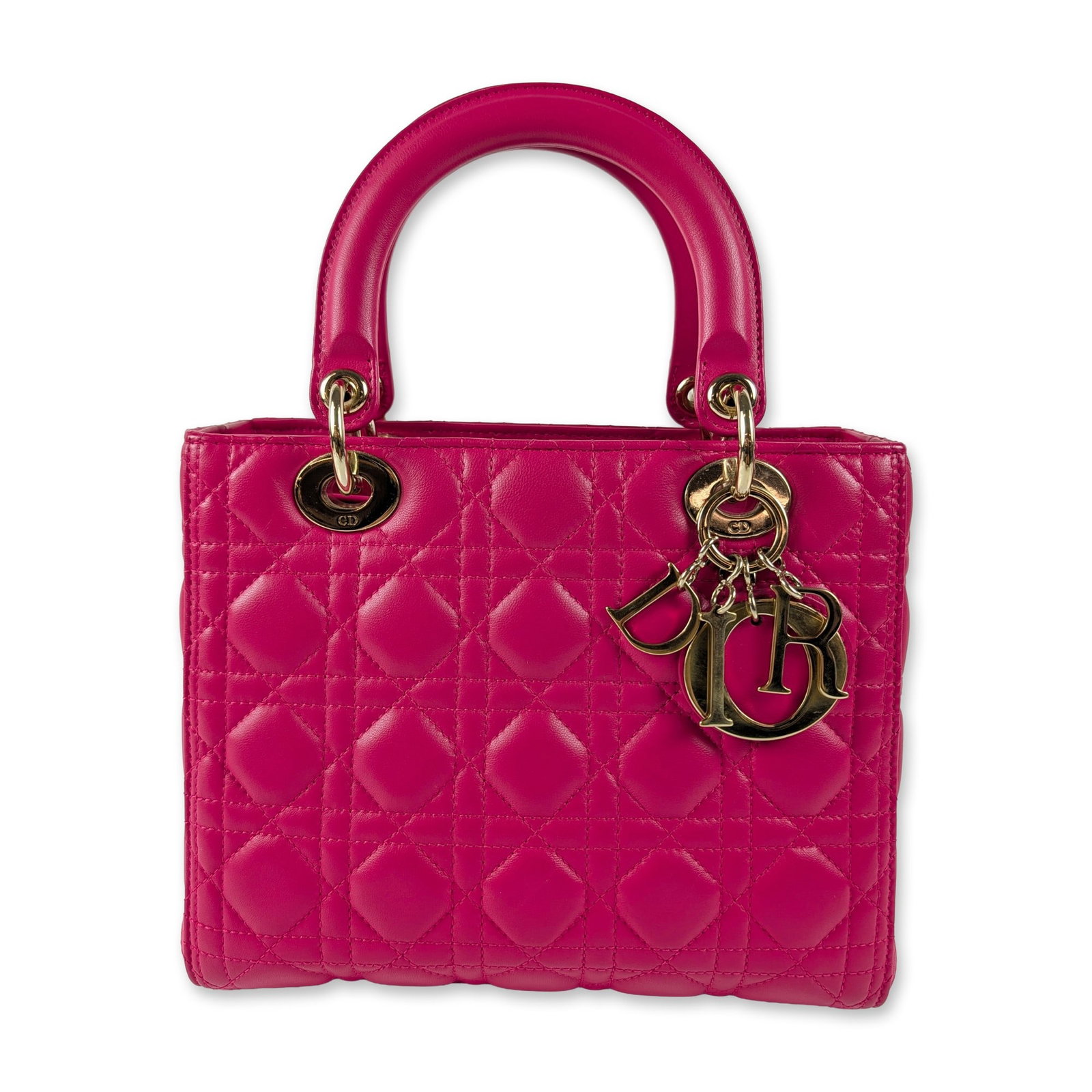 Christian Dior Fuchsia Lambskin Lady Dior Handbag: Christian Dior Lady Dior medium handbag in fuchsia quilted Cannage lambskin leather. Features gold-tone metal hardware, including DIOR letter charms, handle grommets engraved with CD, and a matching o