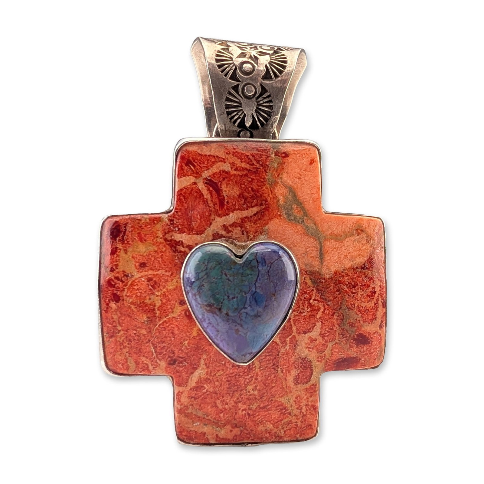 Rocki Gorman Southwestern Sterling Silver Cross Pendant: Southwestern style cross pendant in sterling silver designed by Rocki Gorman. The pendant features an equal-armed cross inlaid with a polished reddish-orange stone, consistent with spiny oyster shell,