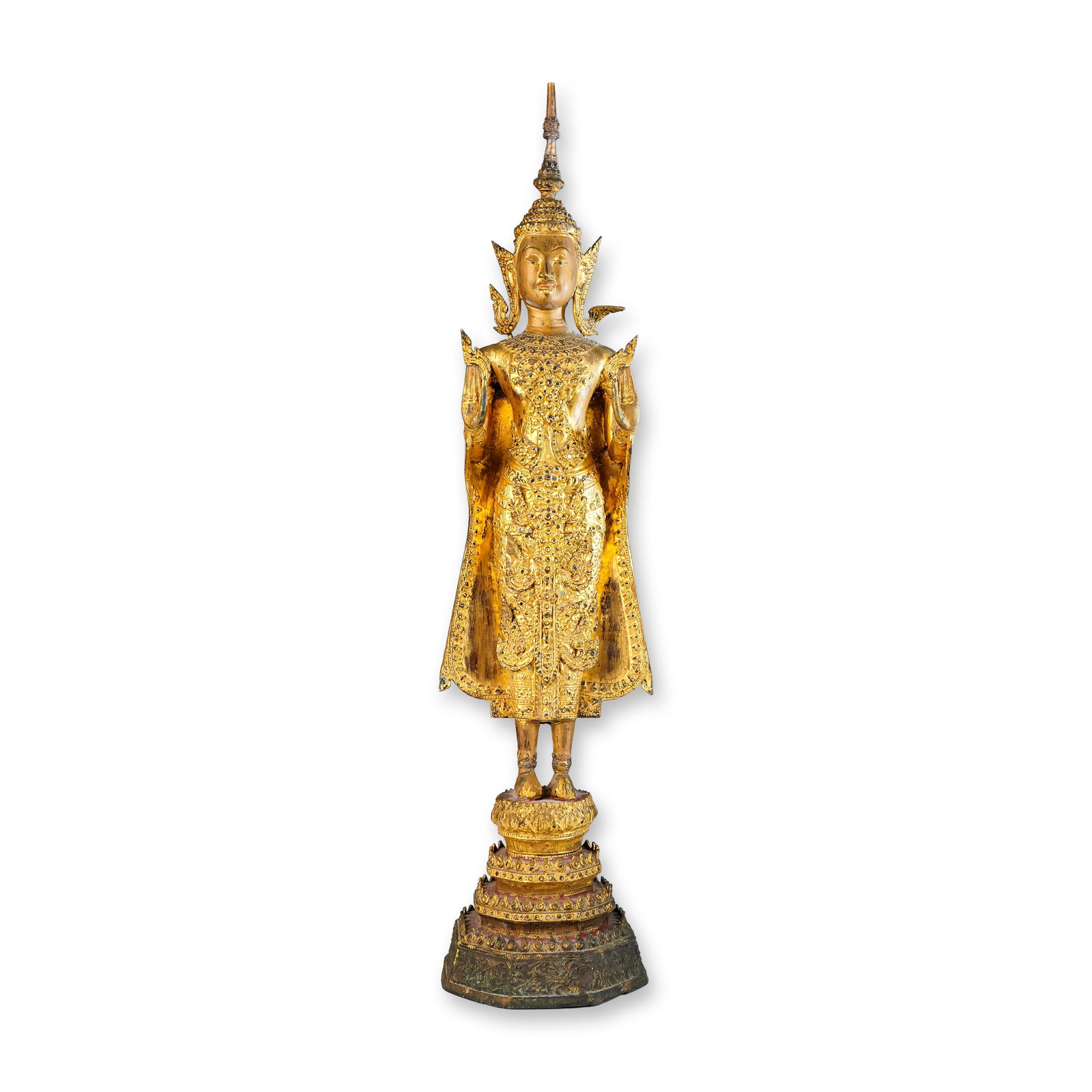 Antique Gilt-Brass Figure, Standing Royal Thai Buddha, Phra Song Khruang: Rattanakosin Period, 19th century. Stands atop an elaborately tiered pedestal base, finely decorated with intricate patterns and motifs typical of the period. Crafted in gilt brass, the statue is rich