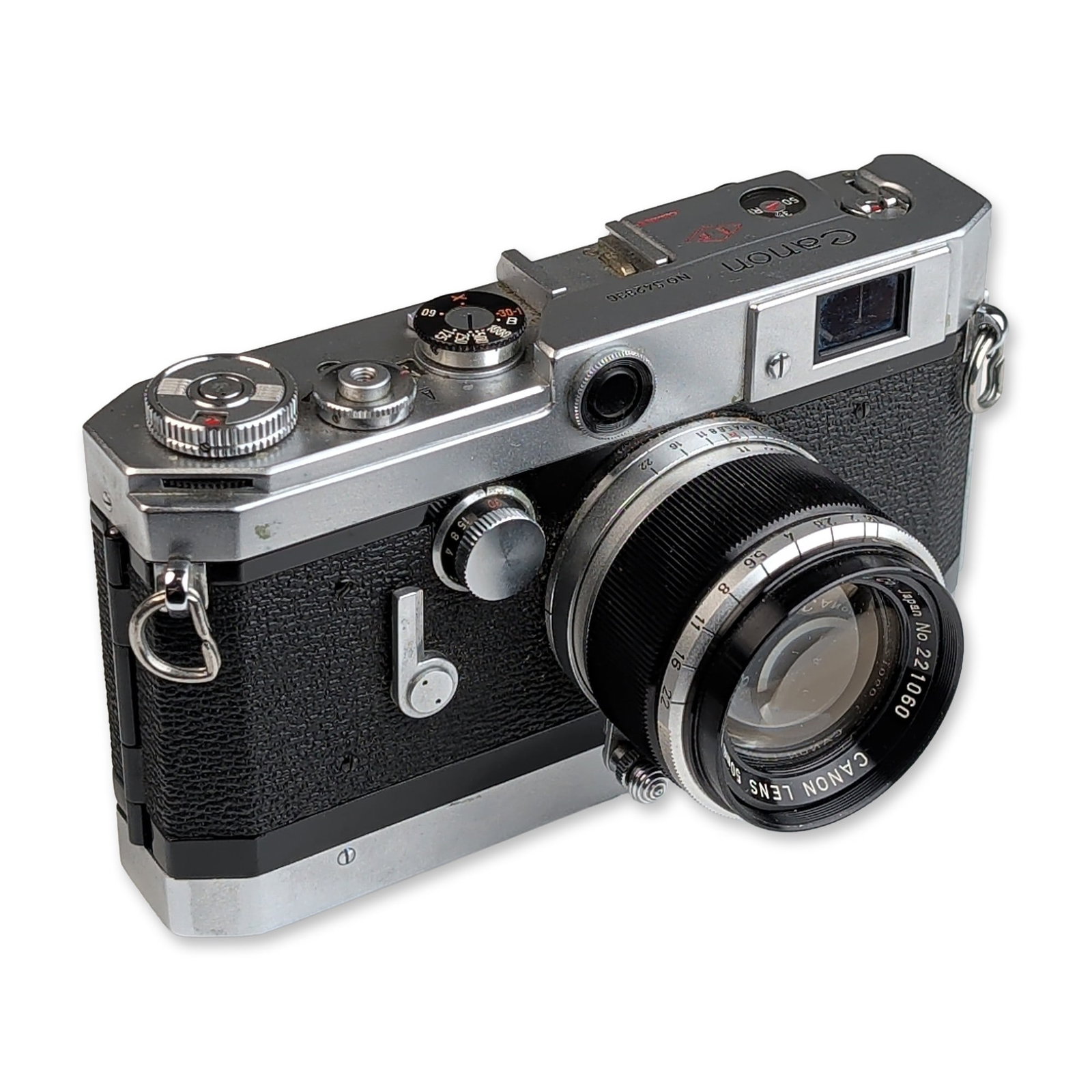 Canon Model VT de luxe 35mm Rangefinder Camera with 50mm f/1.8 Lens and Case: Camera is in chrome-finished metal with a black leatherette grip. The top plate is engraved Canon, NO. 542336, and CANON CAMERA COMPANY INC. JAPAN, and includes a red diamond mark containing the lette