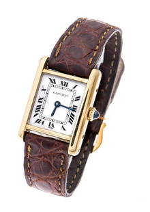 Cartier Tank ladies' watch, Switzerland, c. 1985,: Cartier Tank ladies' watch, Switzerland, c. 1985, manual wind movement, white dial, cabochon crown, watch case no. 7808717886, watch case of 18K gold, brown alligator leather strap with pin buckle, ca