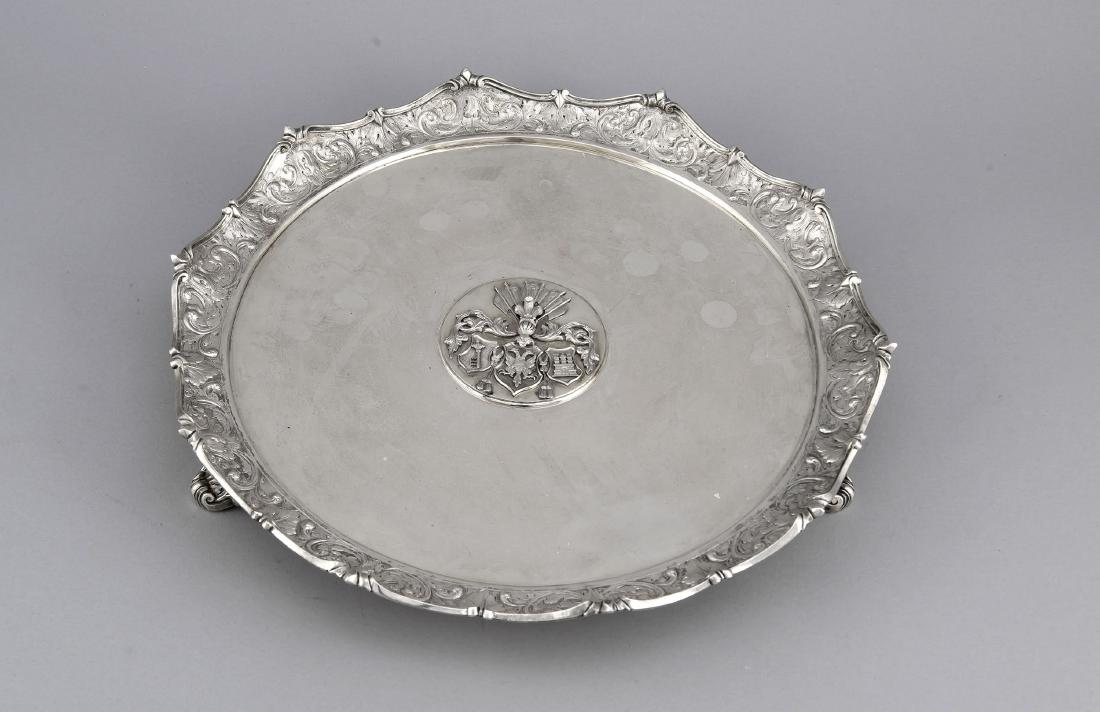 Large Round Tray of the North German Confederation,: Large Round Tray of the North German Confederation, German, 2nd half of the 19th Century,silver hallmarks irrecognisable, on 3 floral decorated feet, curved relief decoration rim with floral motifs, m