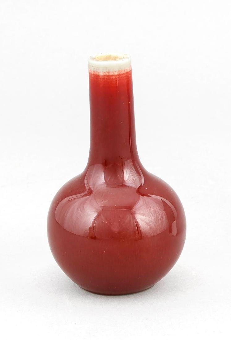 A small copper red Chinese Quig-period flask,: A small copper red Chinese Quig-period flask, presumably 18th/19th c., the stand ring chipped, h. 12 cm Description: A small copper red Chinese Quig-period flask, presumably 18th/19th c., the stand ri