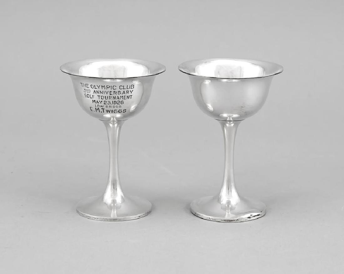 Pair of goblets, USA, aro: Pair of goblets, USA, aroseating group, presumably German, 20th cent., silver tested, each with ornamental or figurative decor, table, bench and 4 chairs, h. to 4.5 cm, approx. 108 g